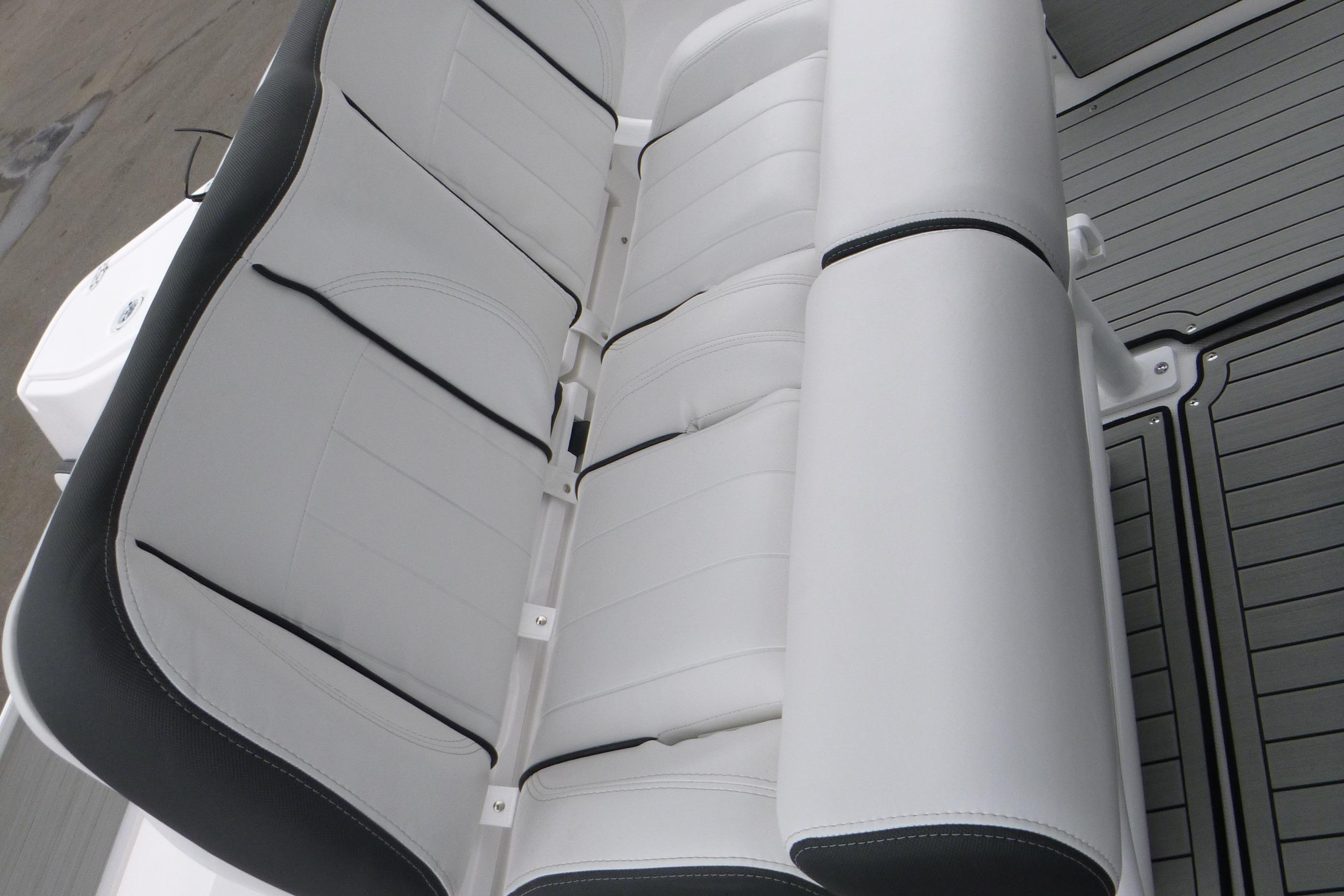 White cushioned seating on 2026 Yamaha Boats 255 FSH Sport H, featuring sleek design.