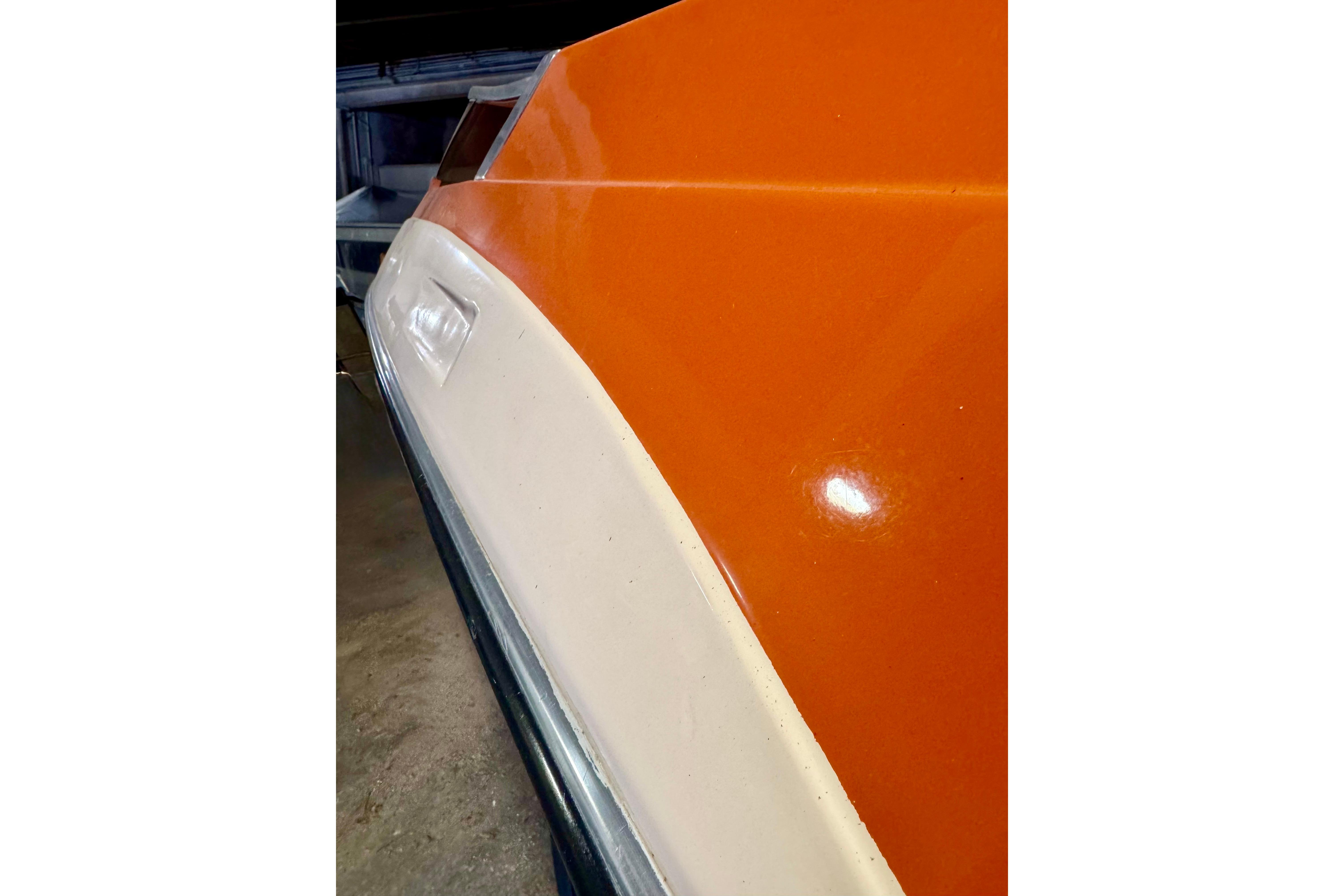 1971 Glastron/Carlson GT 15 boat with orange and white exterior detail.