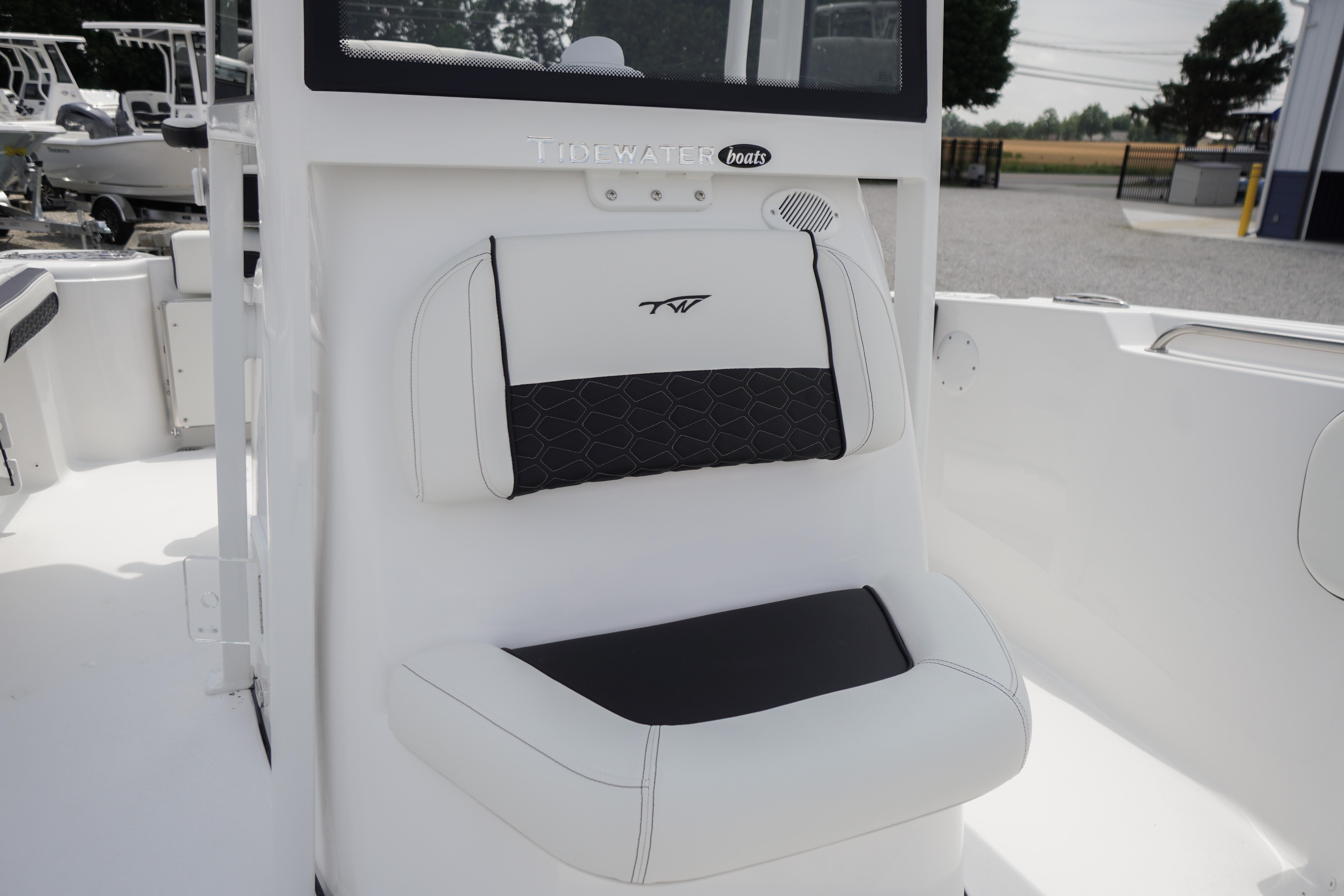 2027 Tidewater 220 CC Adventure boat seat, featuring sleek white and black design.