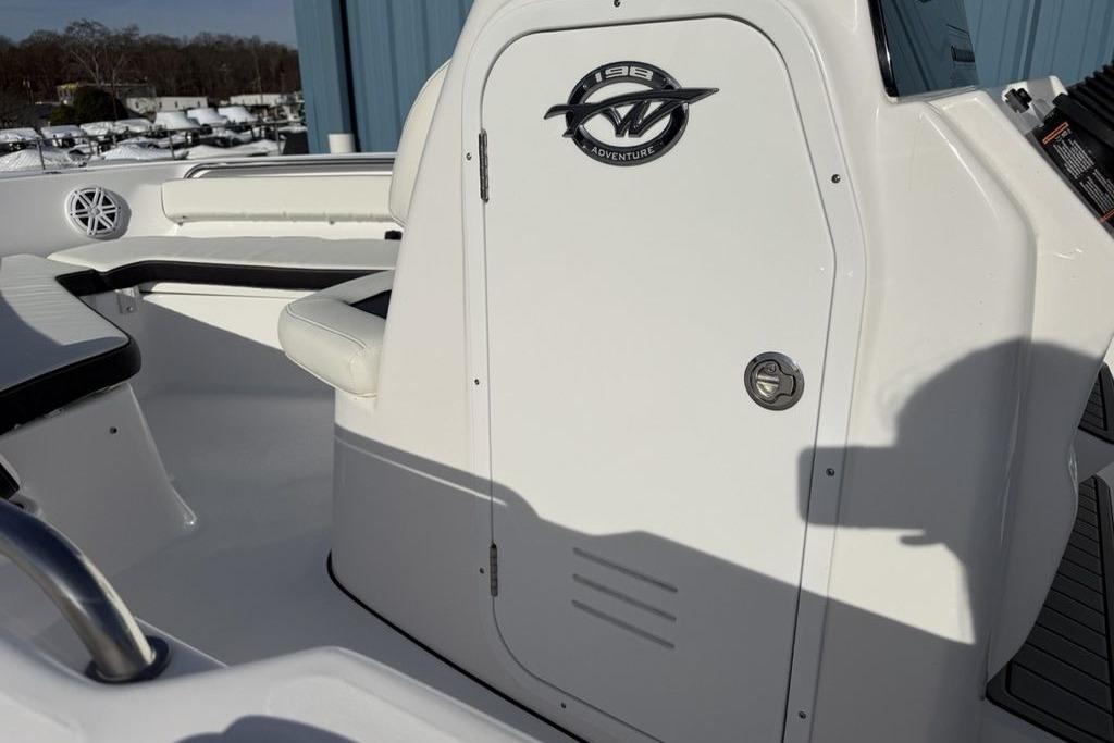2026 Tidewater 198 CC Adventure boat interior with seating and storage compartment.