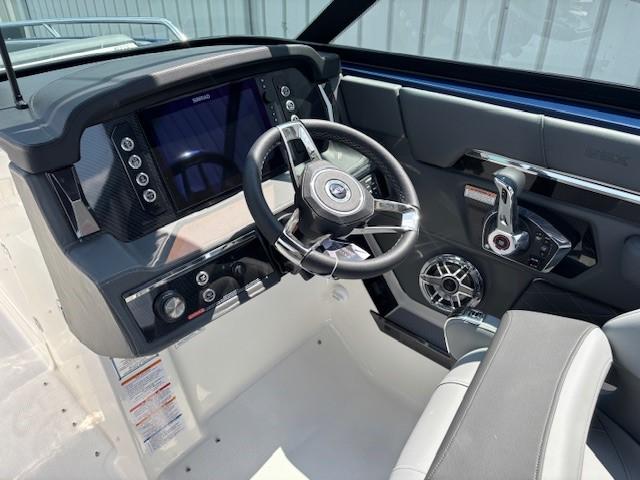 2026 Chaparral SSX 6 boat dashboard with steering wheel and control panel.