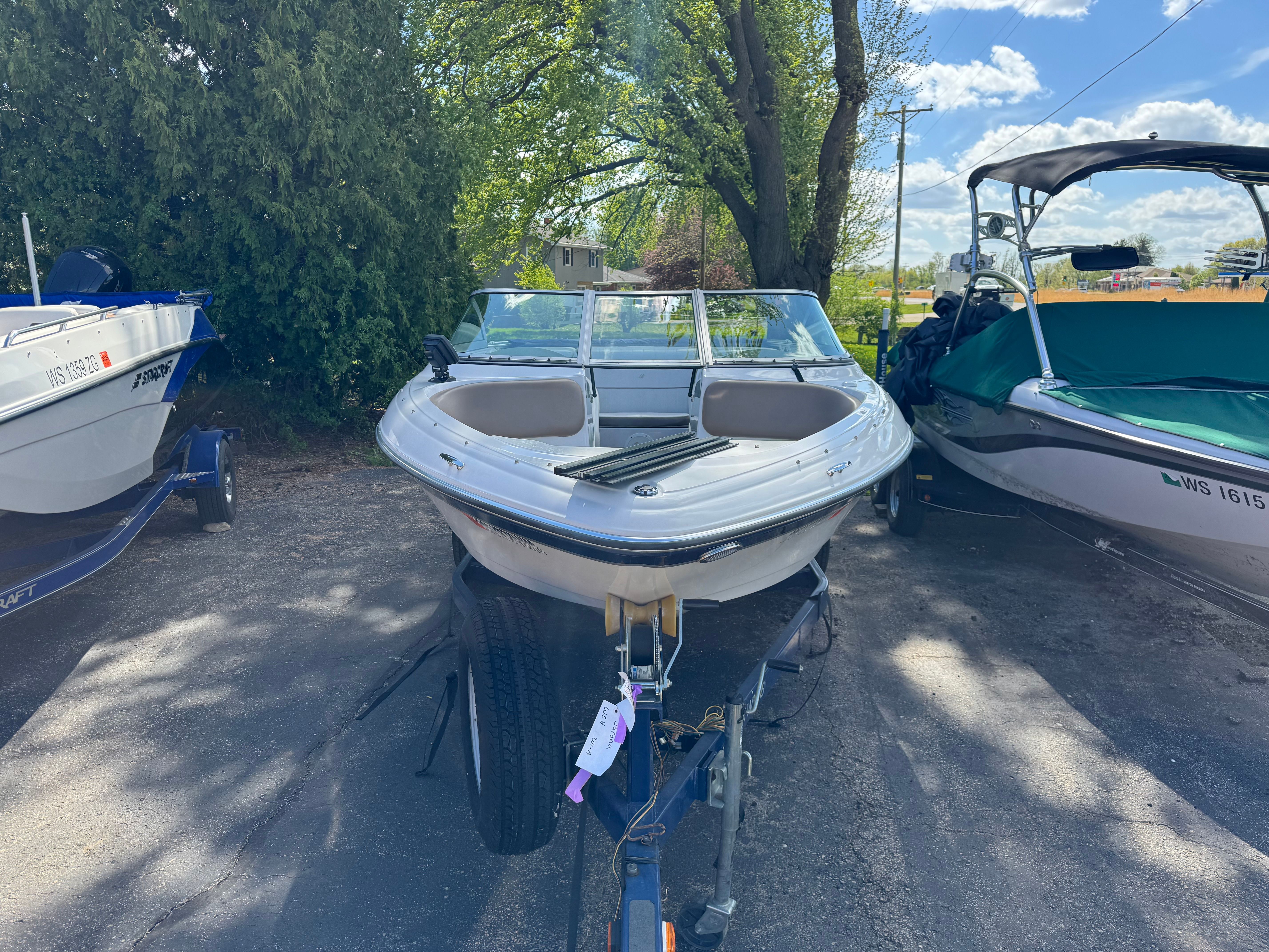 2008 Four Winns 183 Horizon FS boat on trailer outdoors.