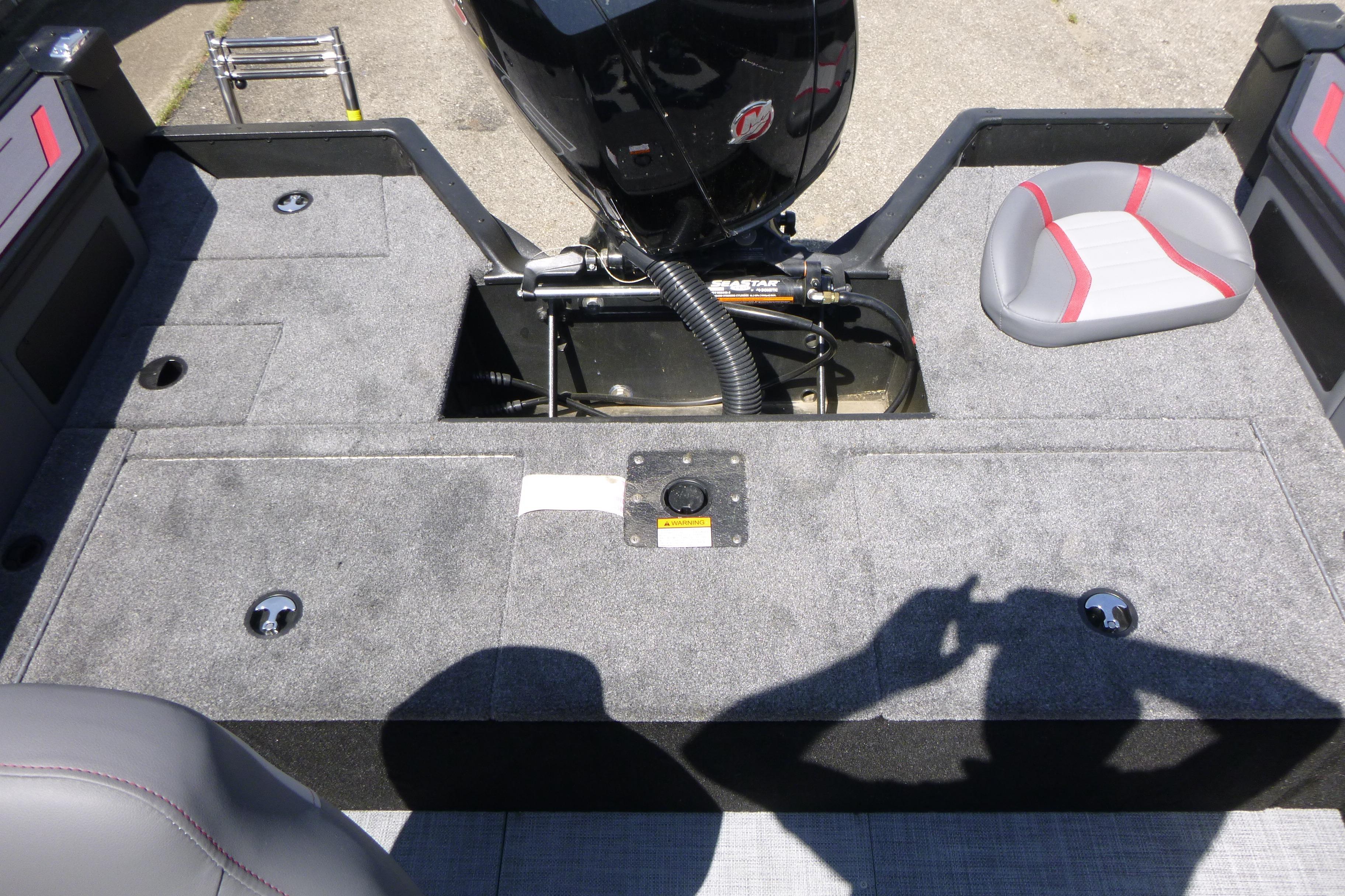 2025 Alumacraft Trophy 185X Sport boat interior with motor and seating.