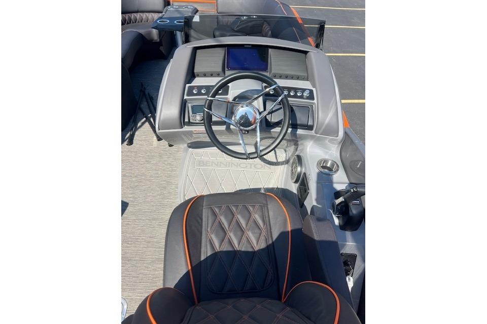 2024 Bennington 23 RXFBA boat dashboard with steering wheel and control panel.