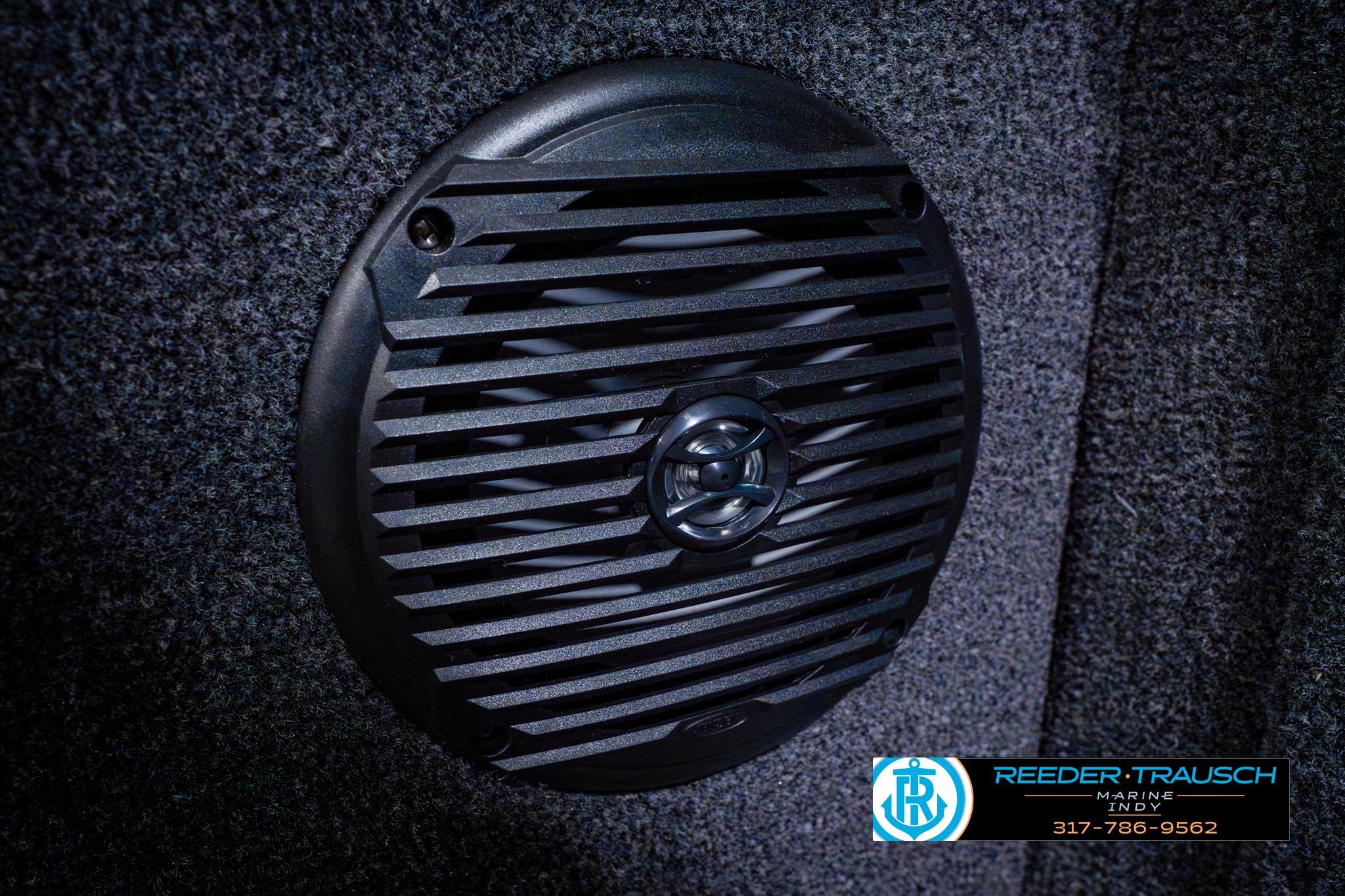 Speaker detail in 2026 Lund 1875 Impact XS boat interior, featuring Reeder-Trausch Marine branding.