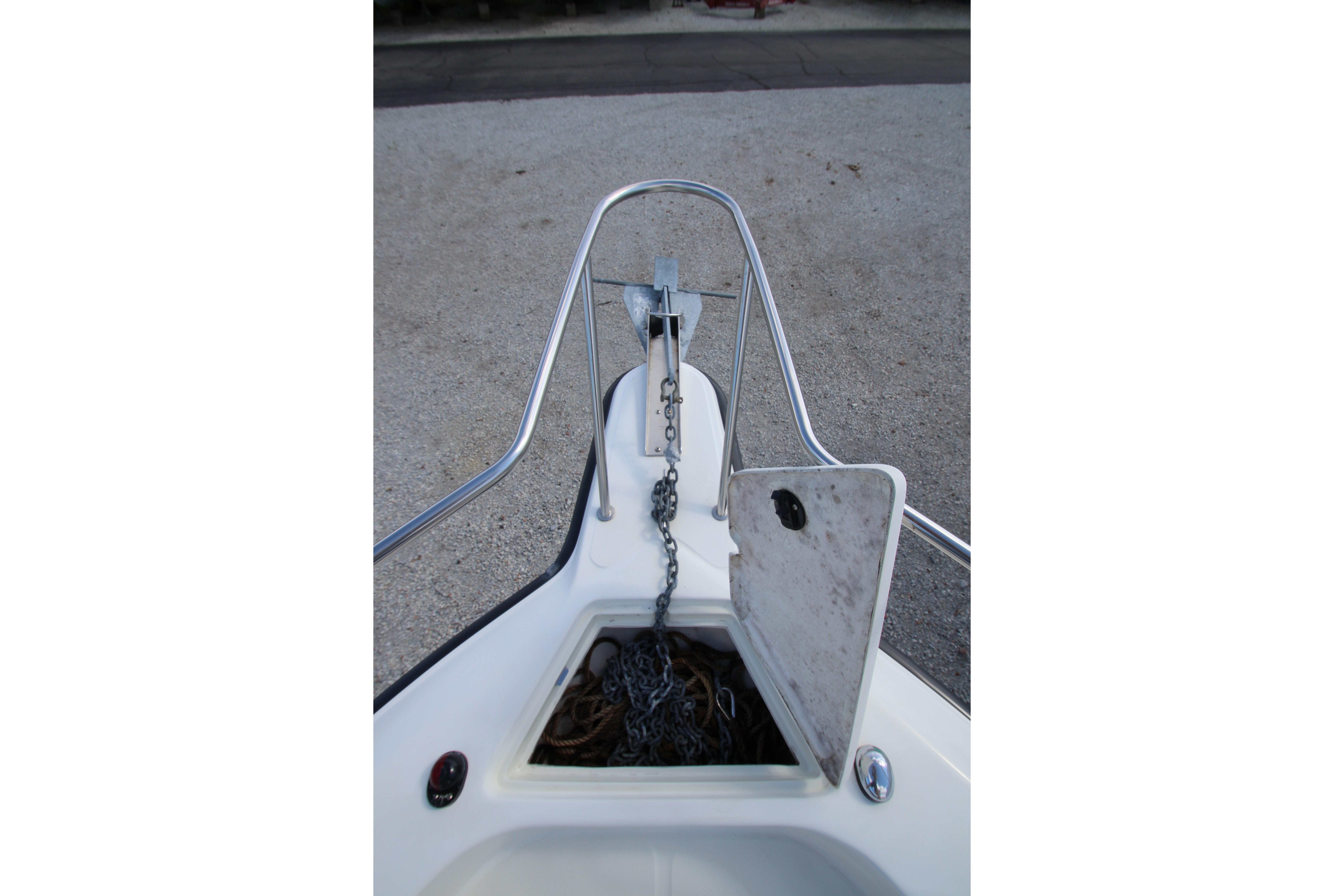 Bow view of 2002 Hydra-Sports 230 WA with anchor chain and storage compartment.