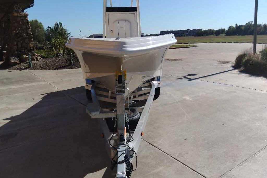 2026 Ranger 2510 Bay boat on trailer, parked outdoors on a sunny day.