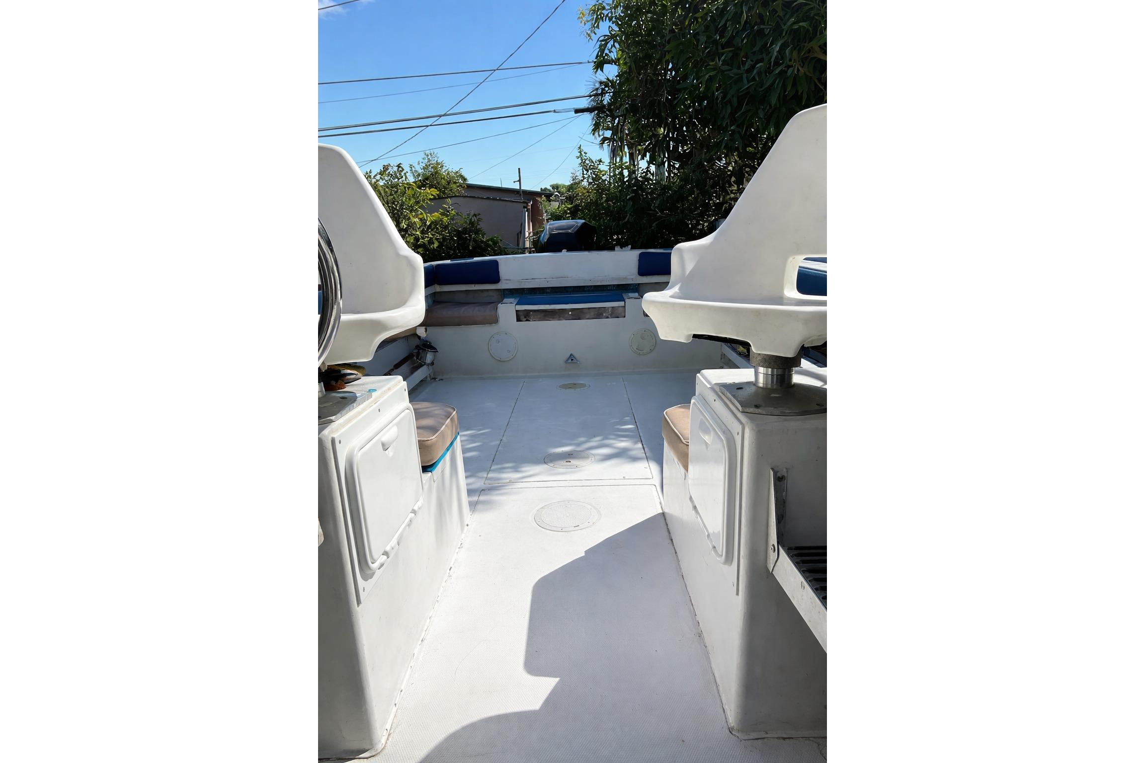 1989 Grady-White Offshore 242 boat interior with seating and storage compartments.