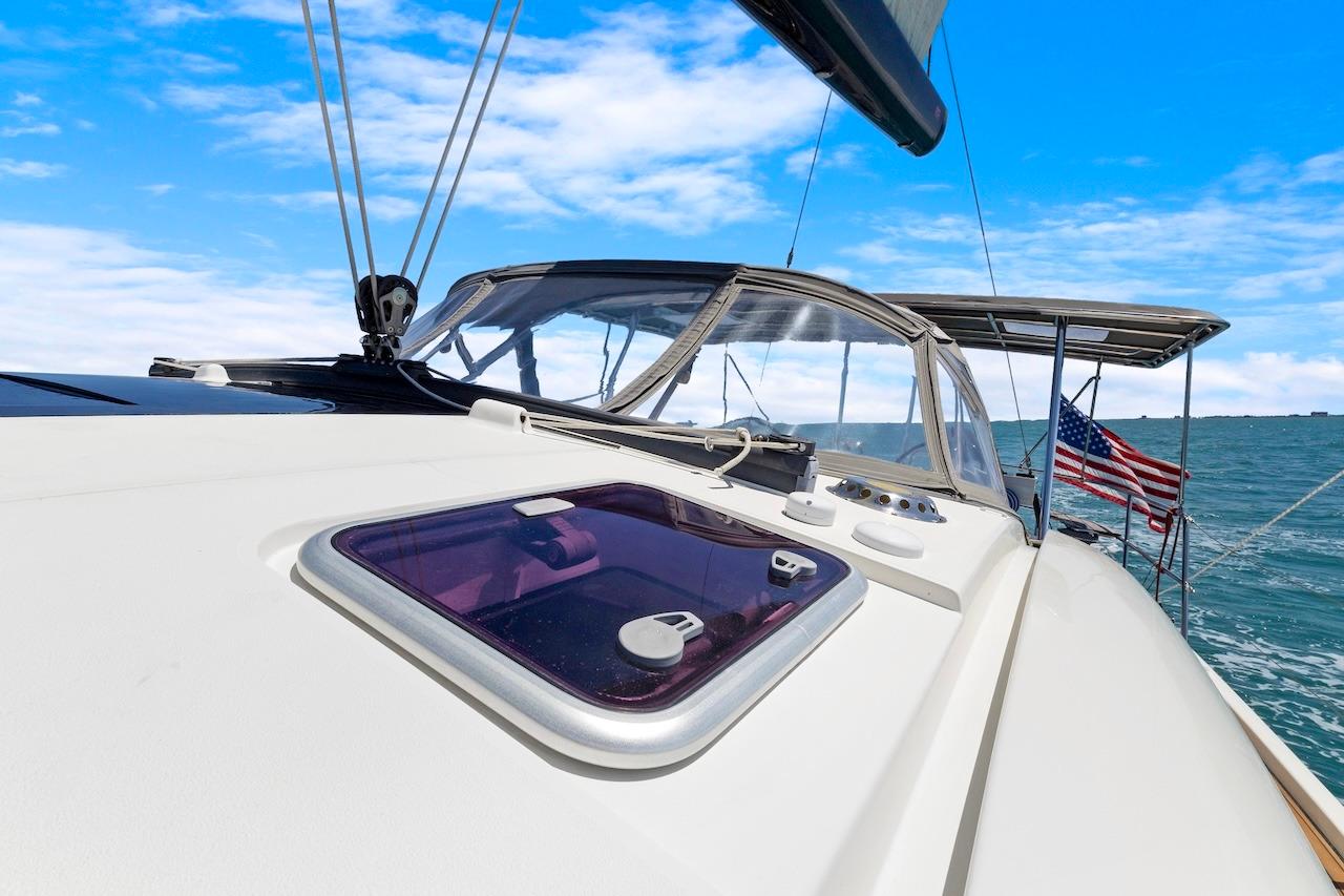 Sailing yacht Southerly 57 RS, 2011 model, on open sea with clear blue sky.