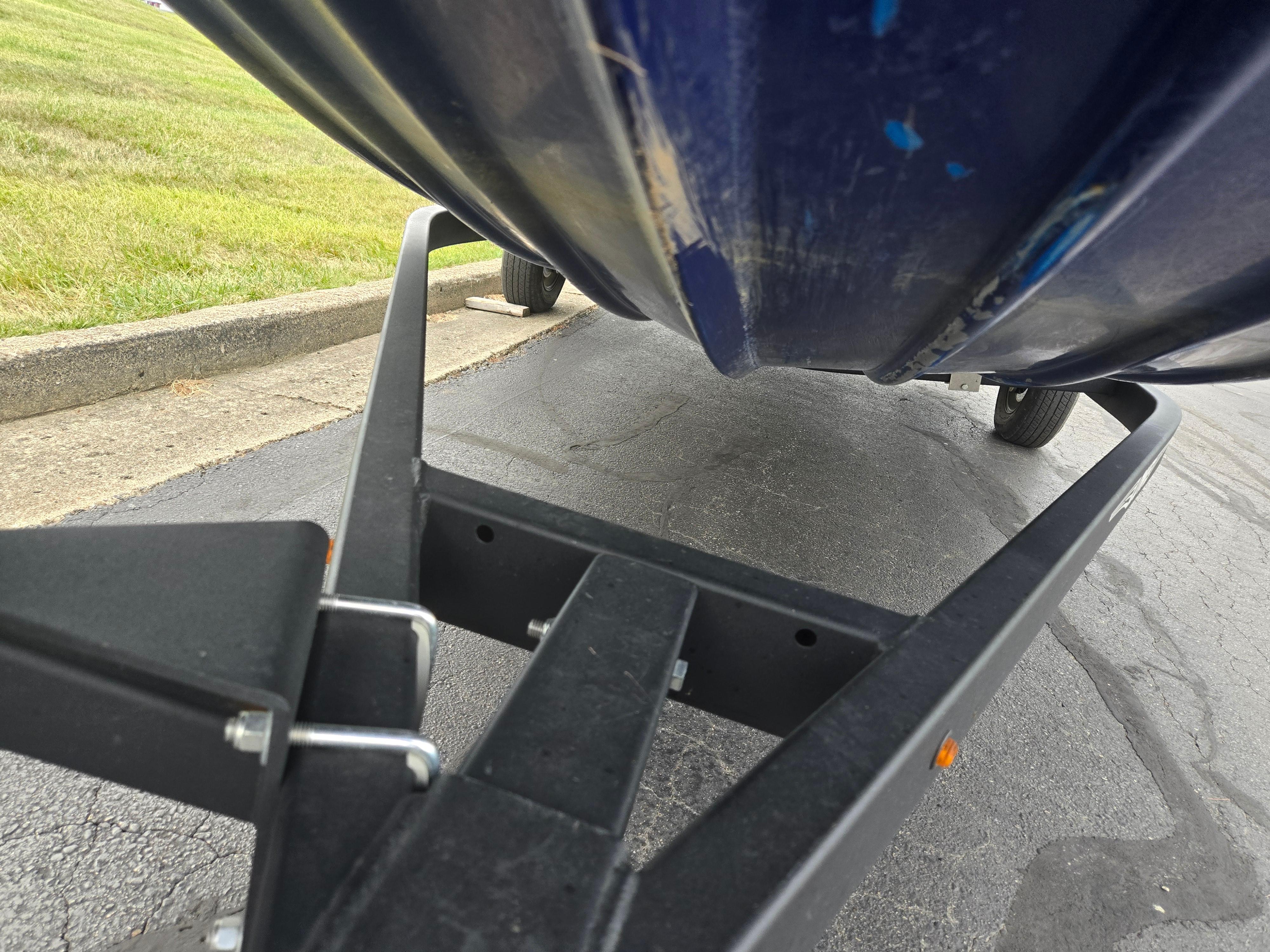 2021 Lowe Stinger 188 boat on trailer, close-up view of hull and frame.