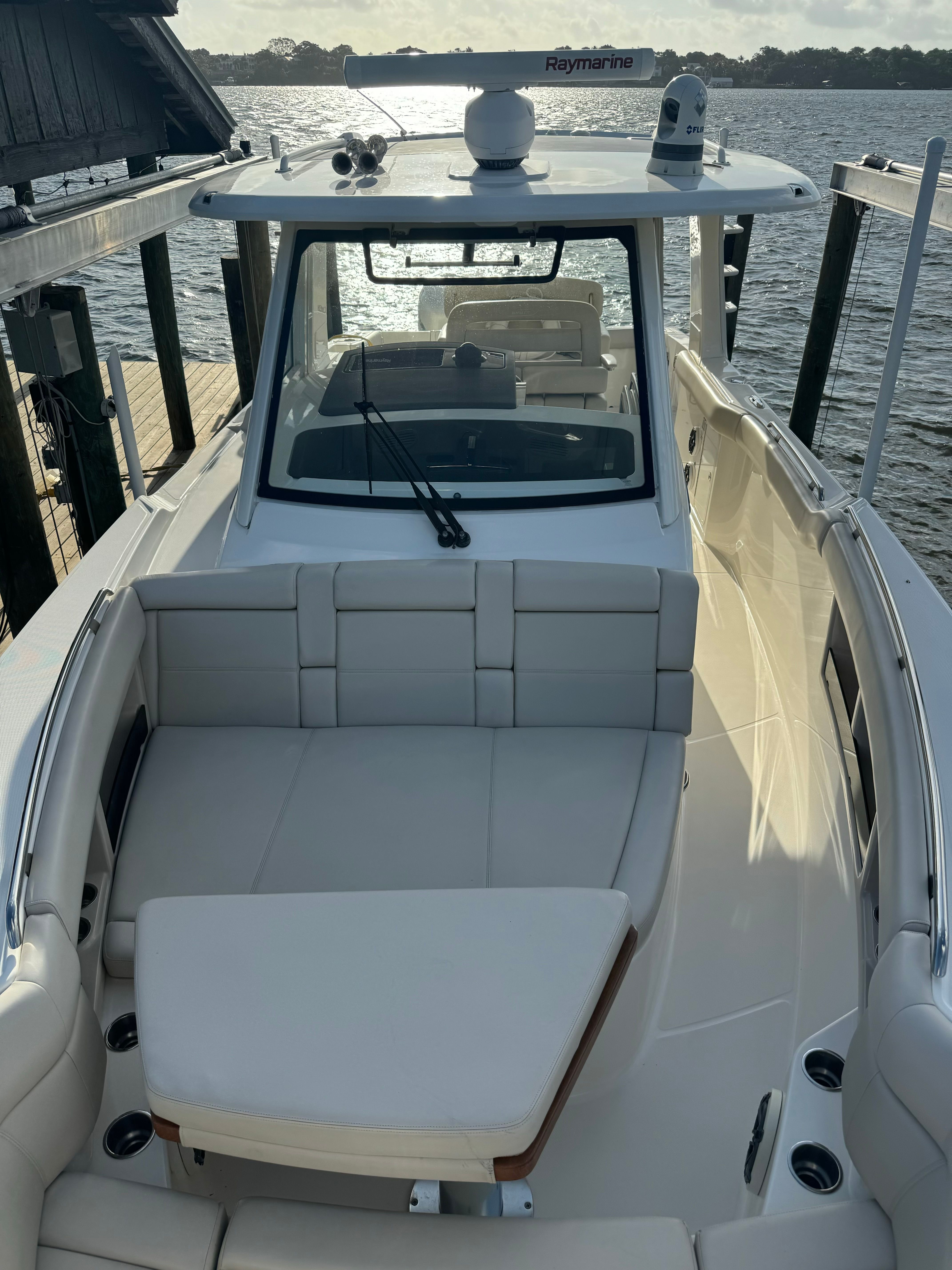 Boston Whaler 350 Realm 2020 on water, luxurious boat deck and seating area.