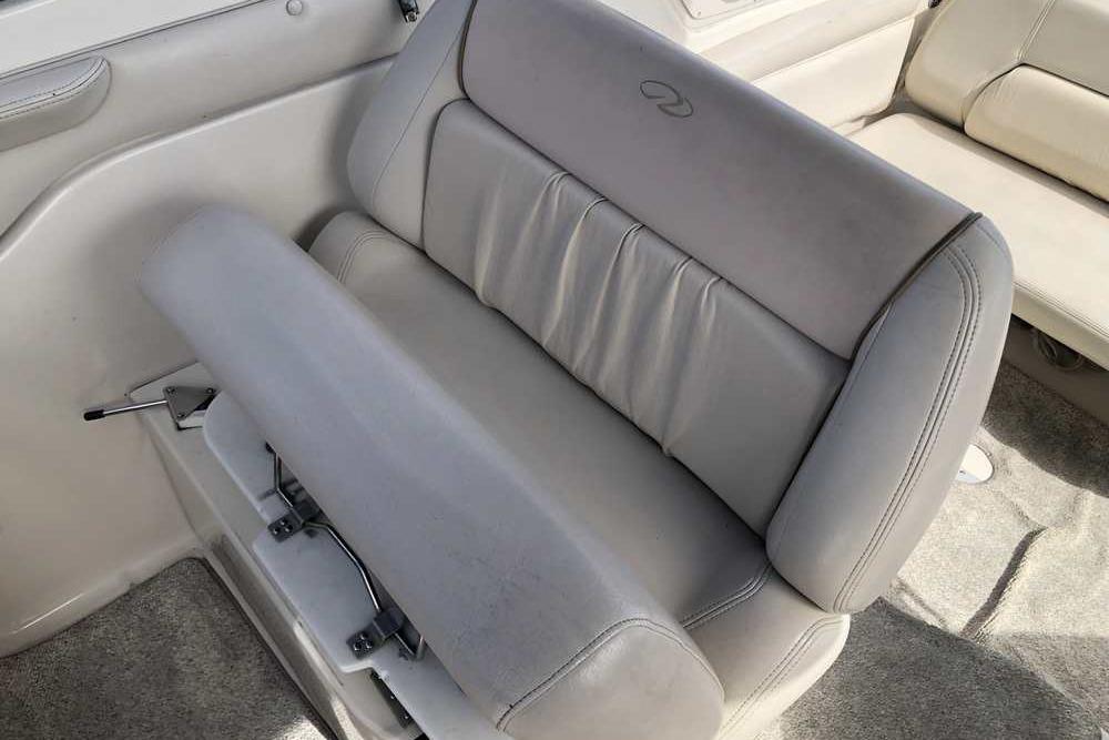 1999 Regal Commodore 2760 boat interior with gray leather seating.