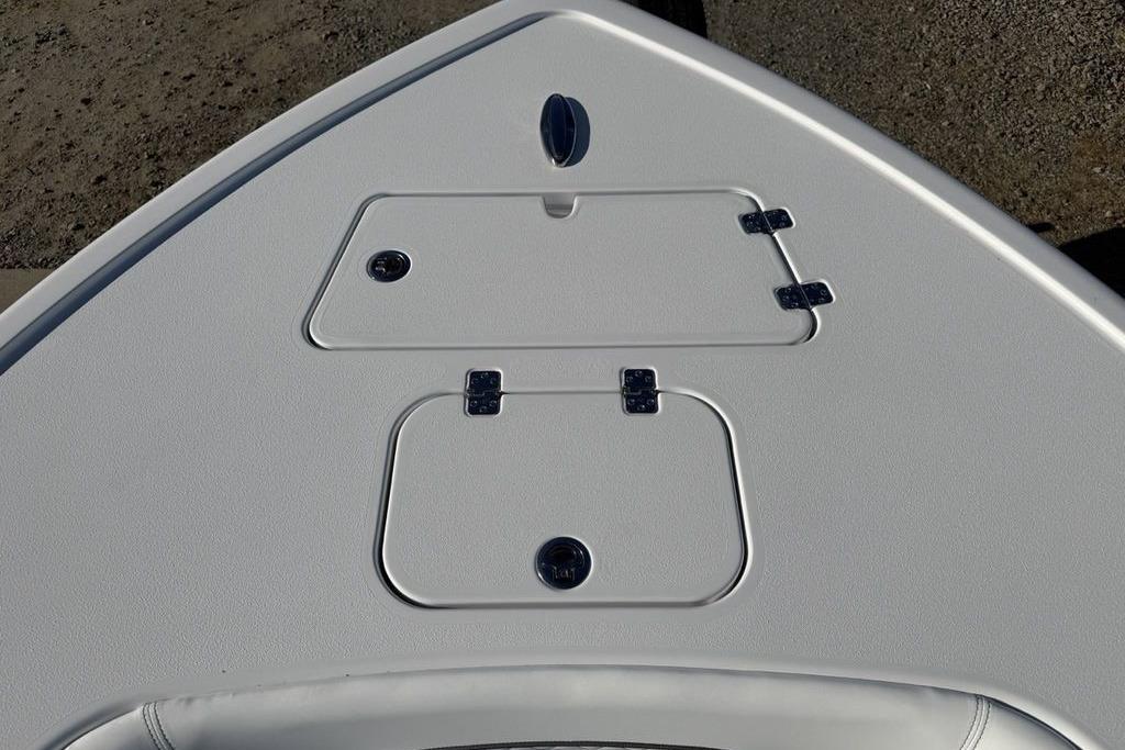 2026 Sportsman Masters 247OE Bay Boat deck with storage compartments.