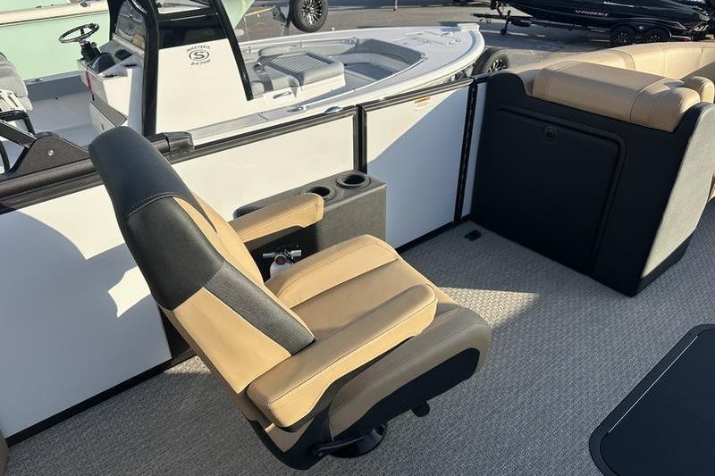Luxurious seating on 2026 Evotti 523CS boat, featuring tan and black upholstery.