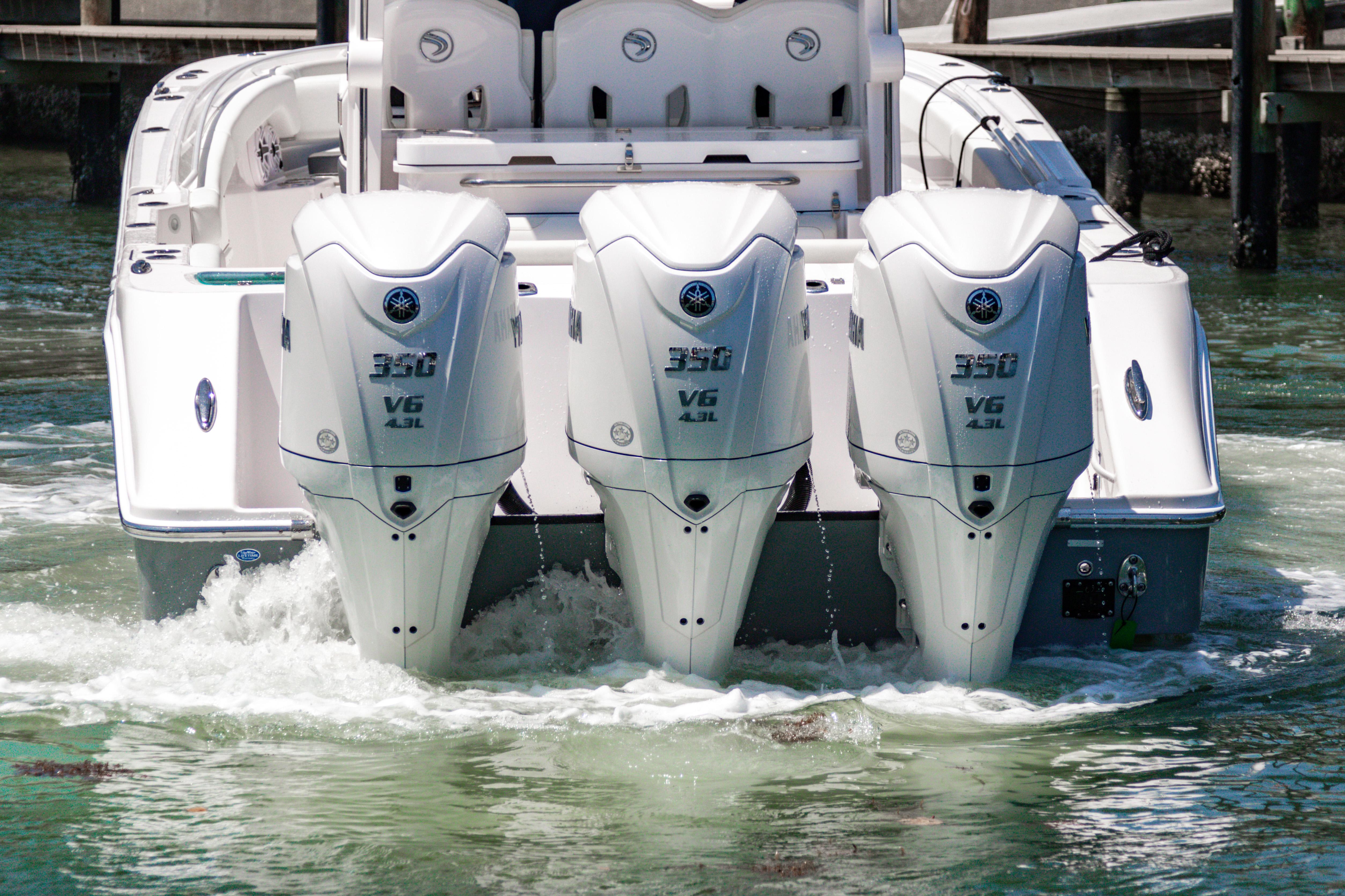 2025 Edgewater 370CC boat with triple Yamaha 350 V6 engines in water.