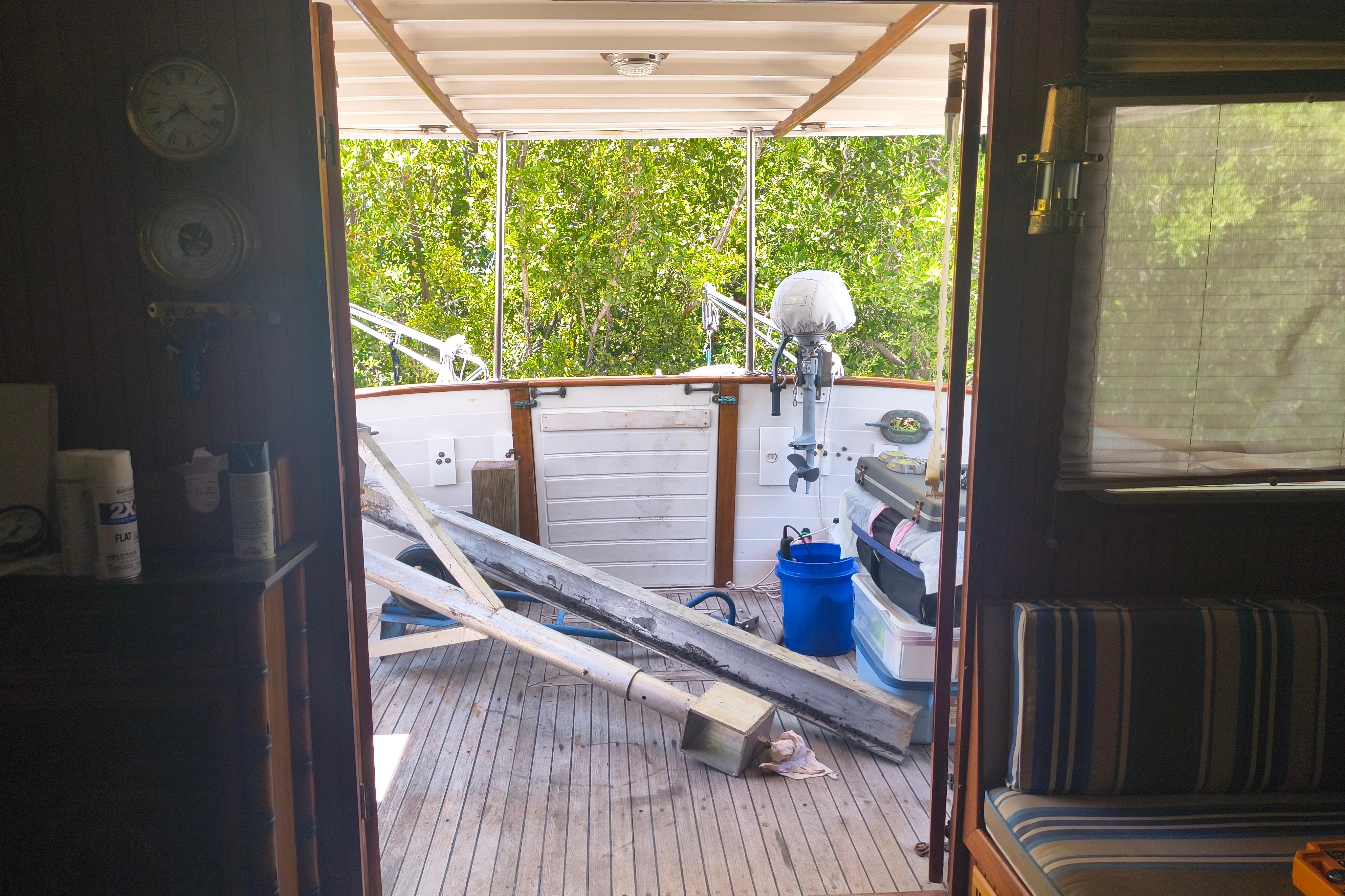 1984 Kadey-Krogen Manatee boat interior with wooden deck and outdoor equipment.