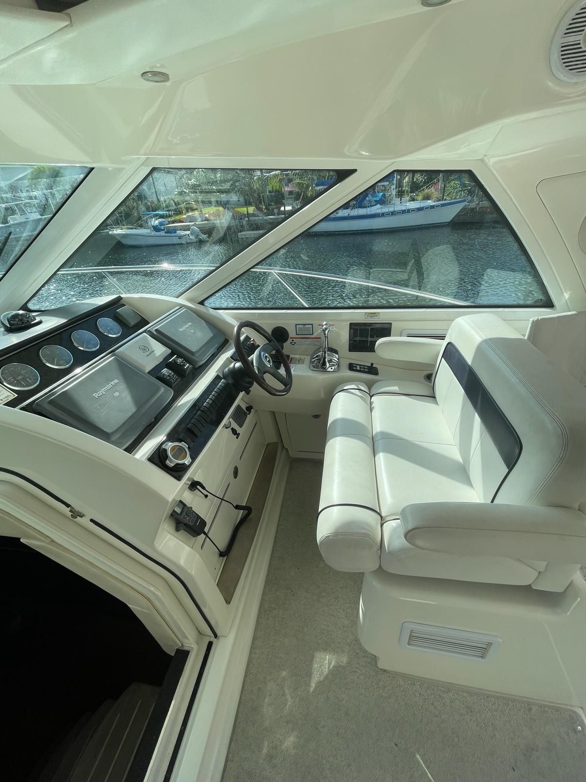 Interior of a 2010 Sea Ray 450 yacht with helm station.