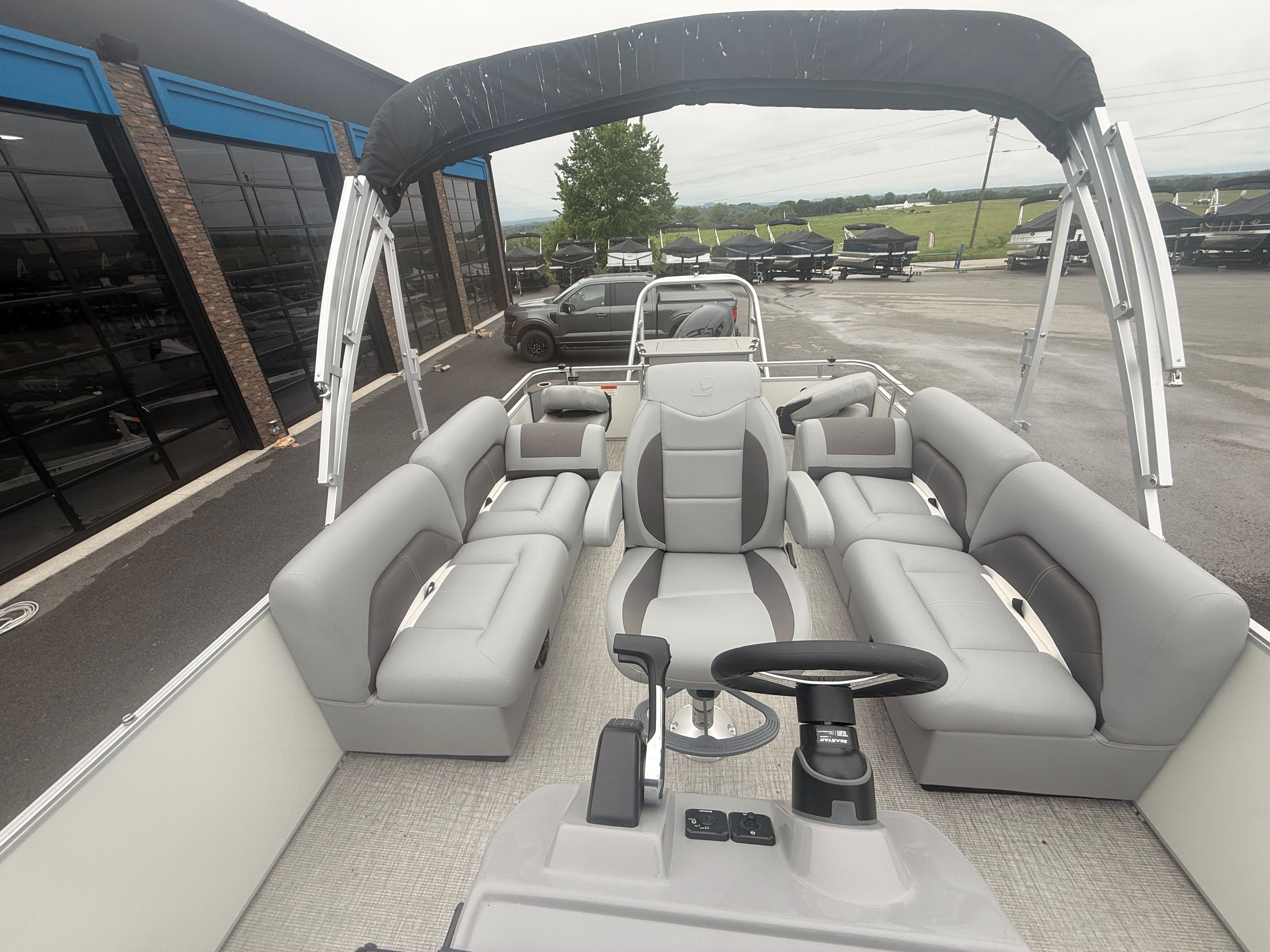Interior of 2026 Landau Alure 23CC Fish with gray seating.