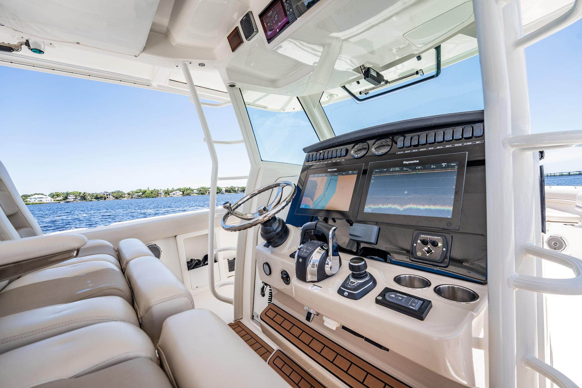2018 Boston Whaler 380 Outrage helm with advanced navigation displays and luxurious seating.