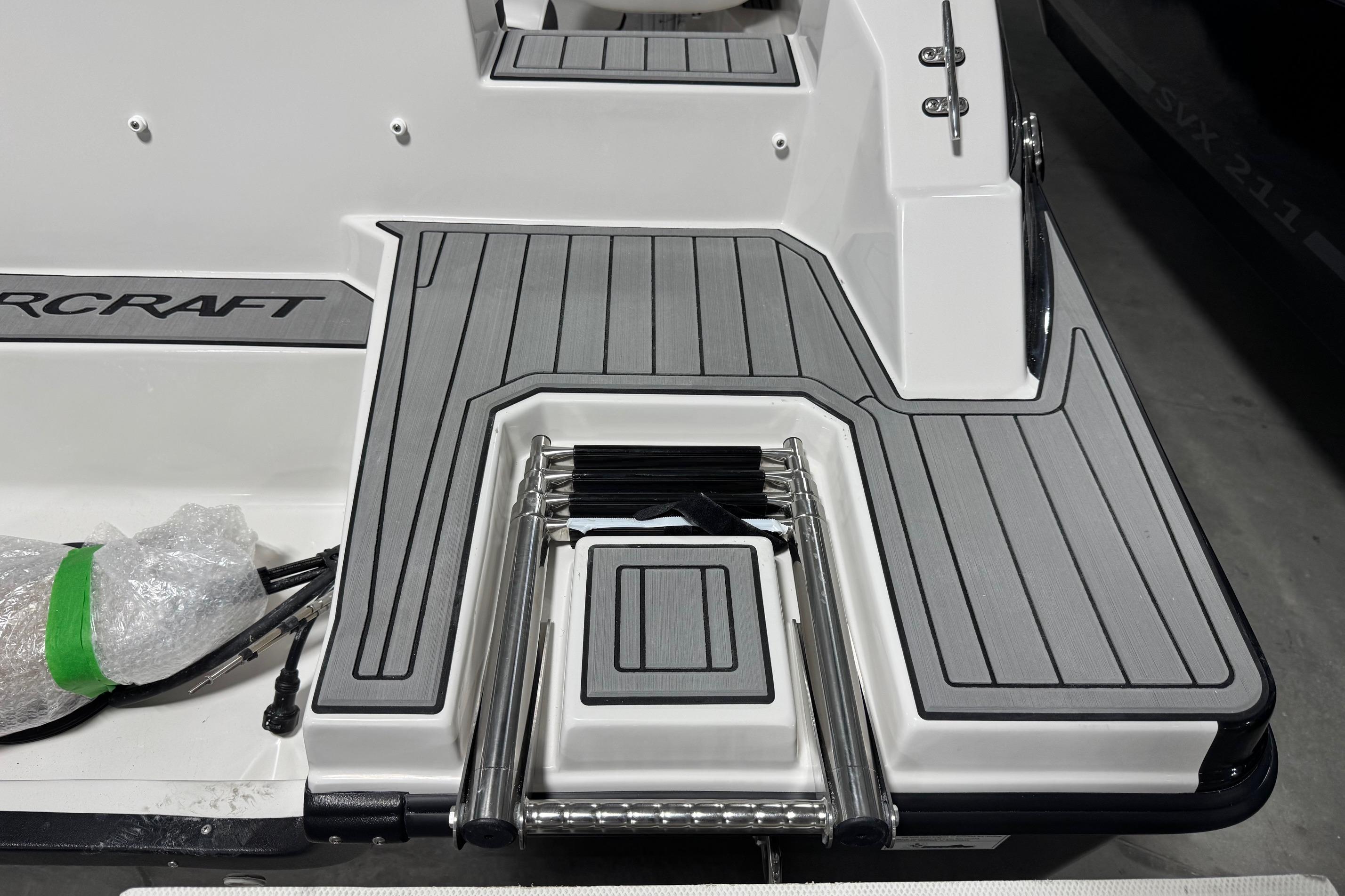 2026 Starcraft SVX 191 OB boat deck with foldable ladder and sleek design.
