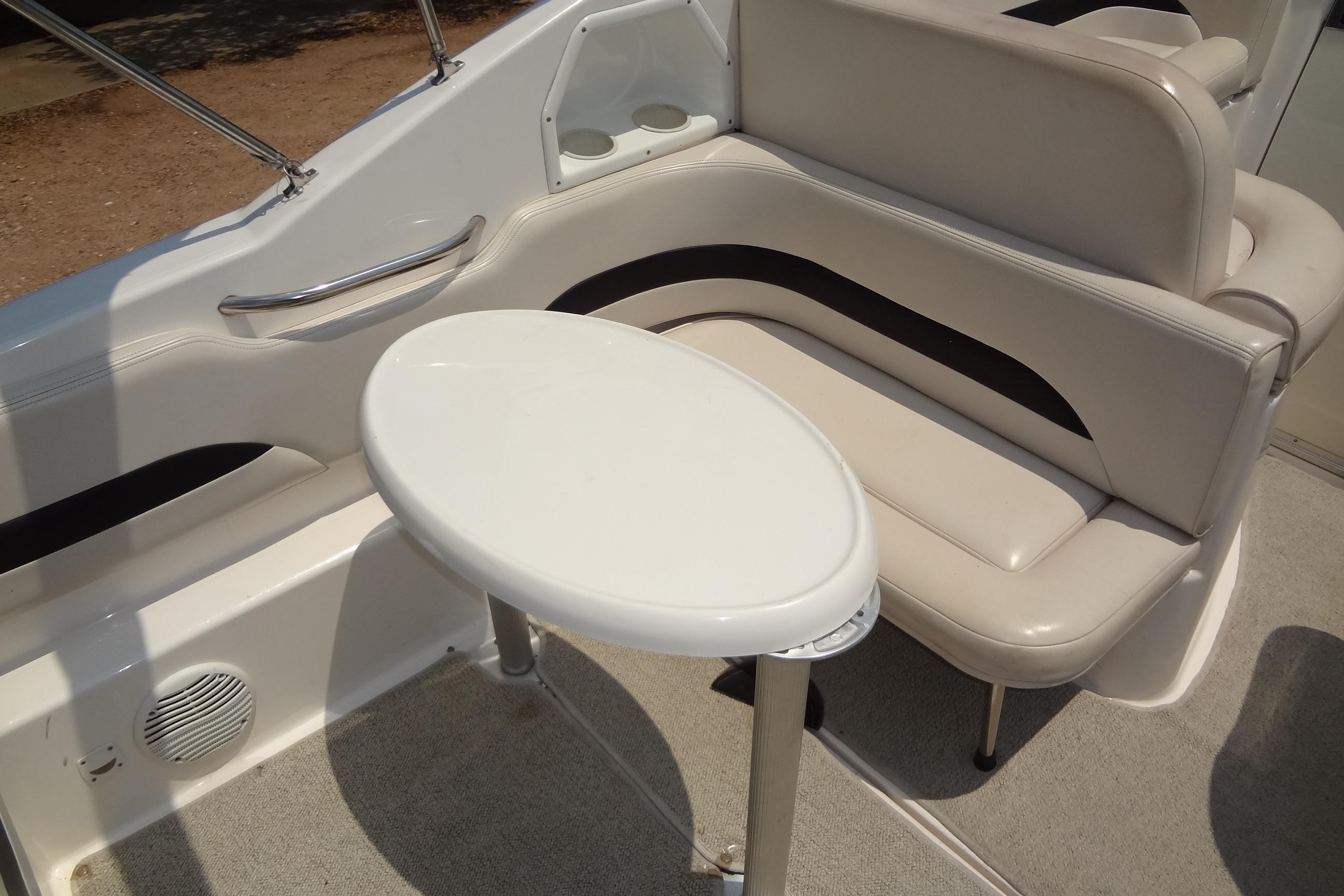 2000 Chaparral Signature 260 boat interior with seating and table.