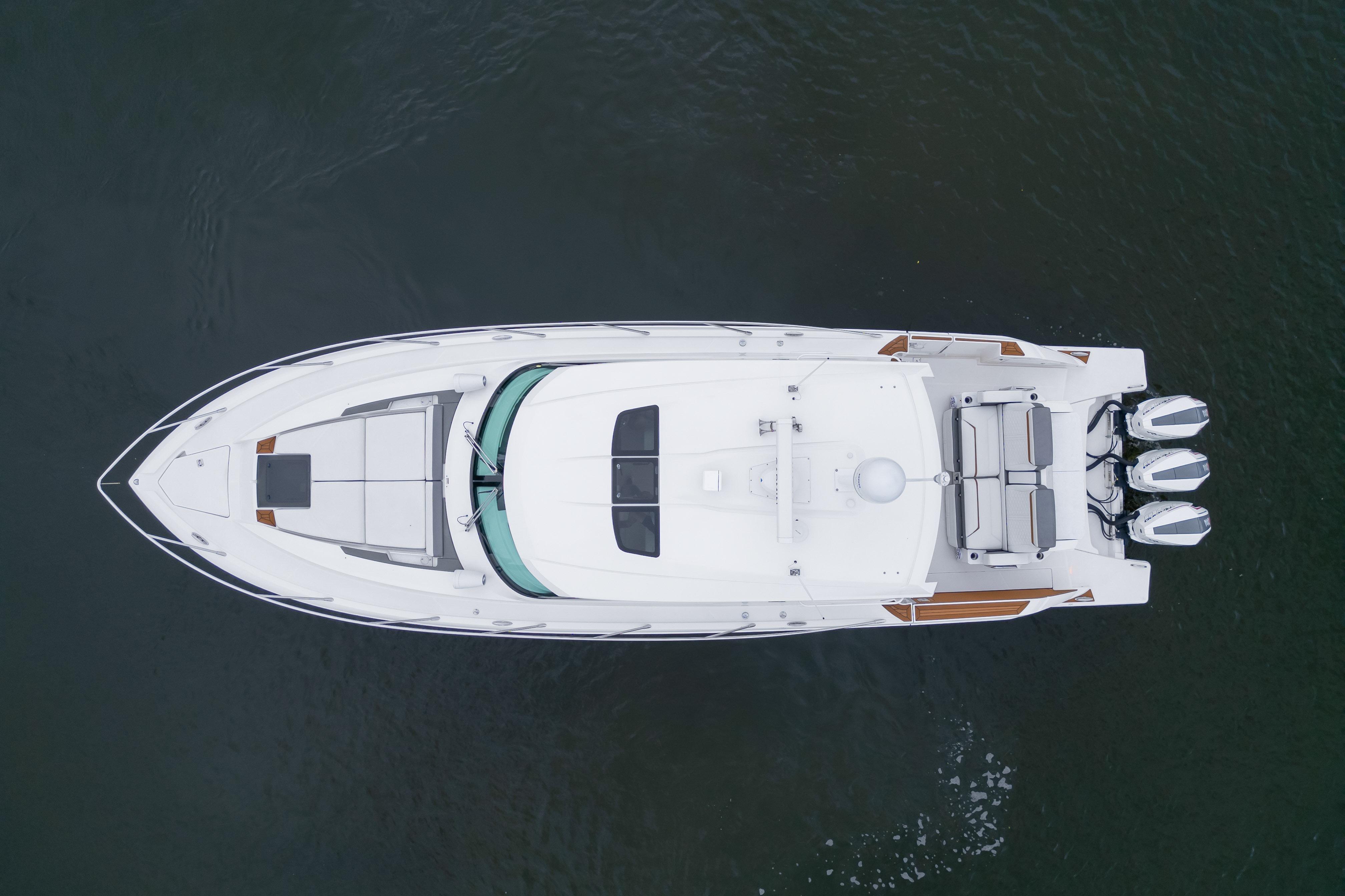 Overhead view of 2021 Tiara Sport 43 LE boat on water.