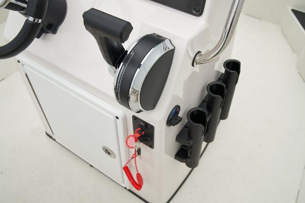 Manufacturer Provided Image: Manufacturer Provided Image: Control panel of 2025 Ranger RB210 boat with throttle and rod holders.