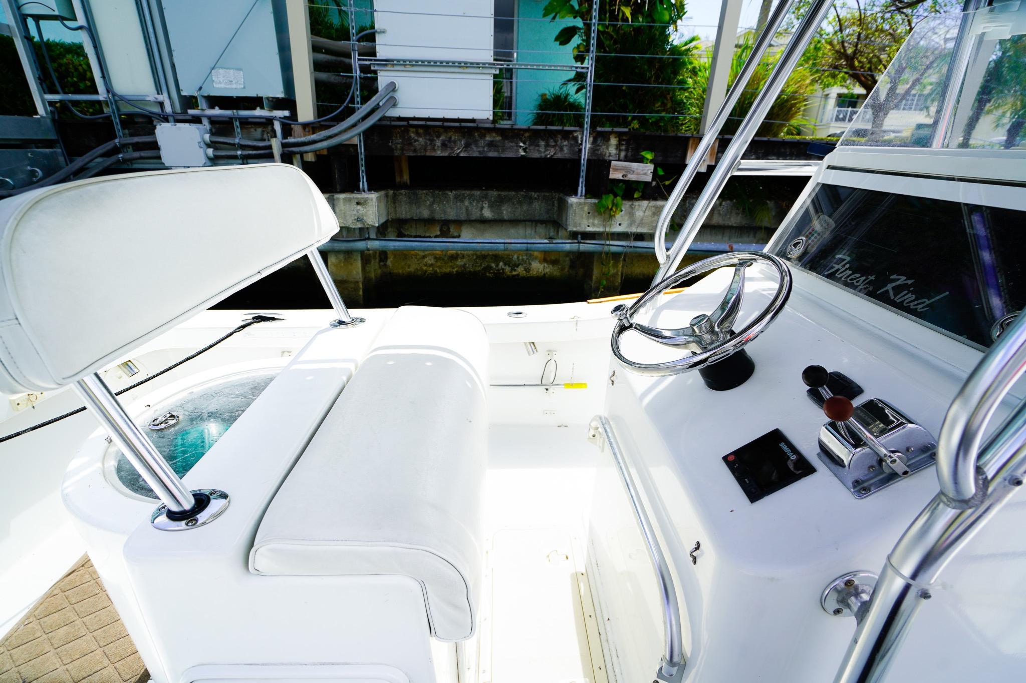 1977 Scarborough 27 CC boat interior with steering wheel and controls.