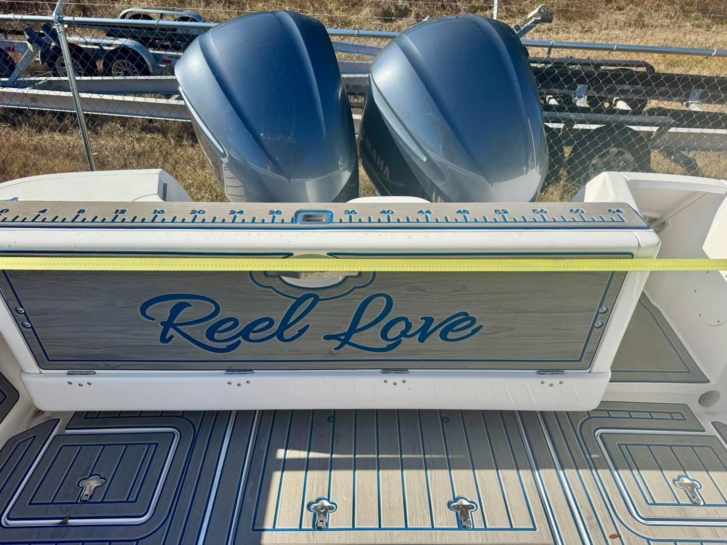 Intrepid 327 Nomad 2021 with "Reel Love" lettering and twin outboard motors.