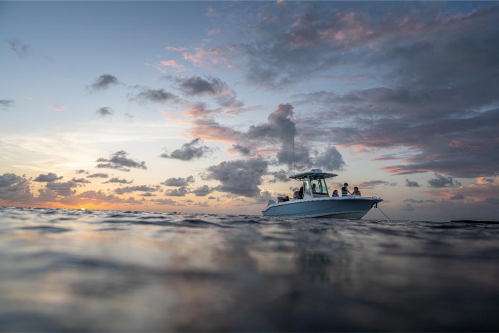 2024 Boston Whaler 280 Dauntless at sunset on the open water.