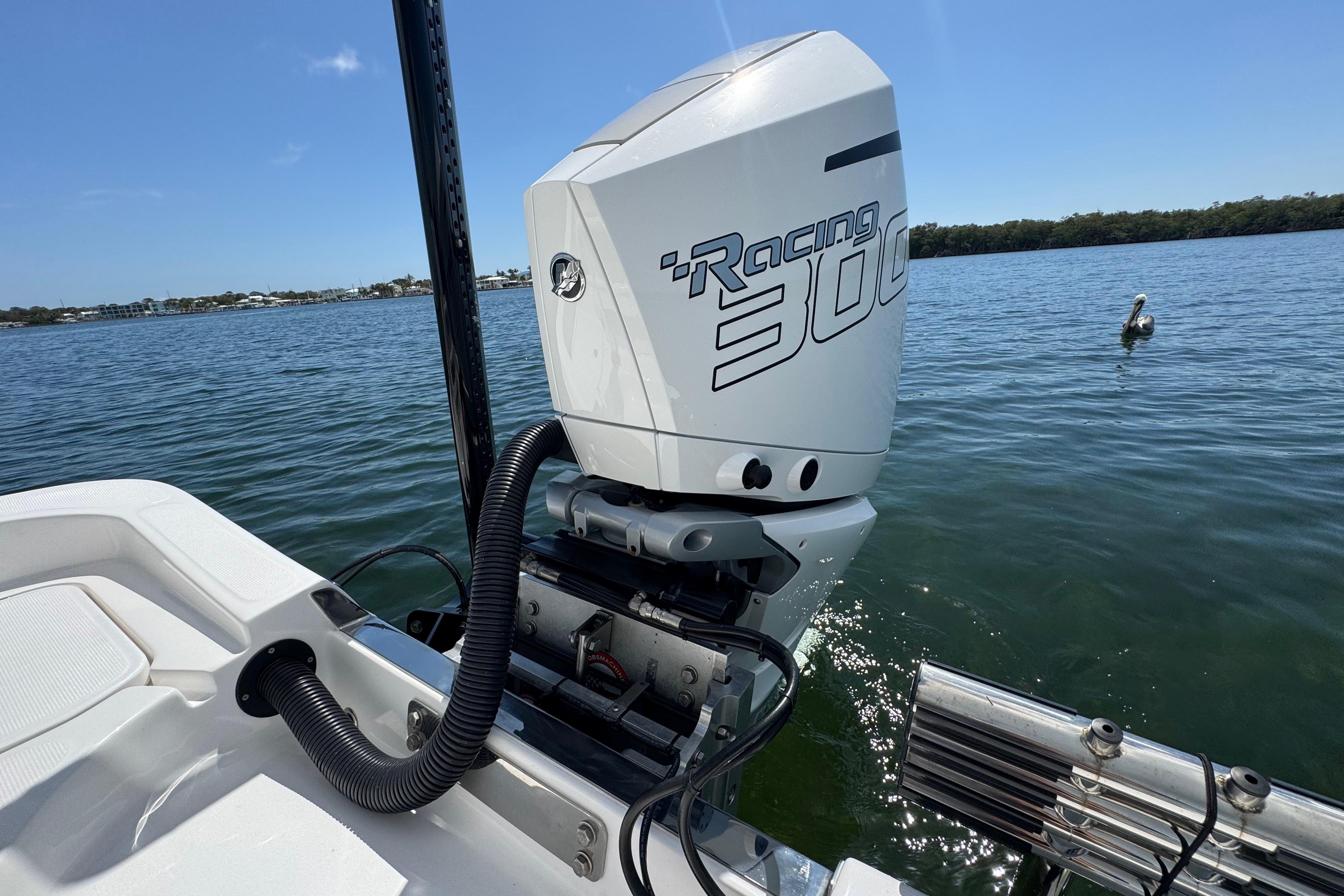 2025 Blackwater 23 Bay boat with powerful Racing 300 engine on calm water.