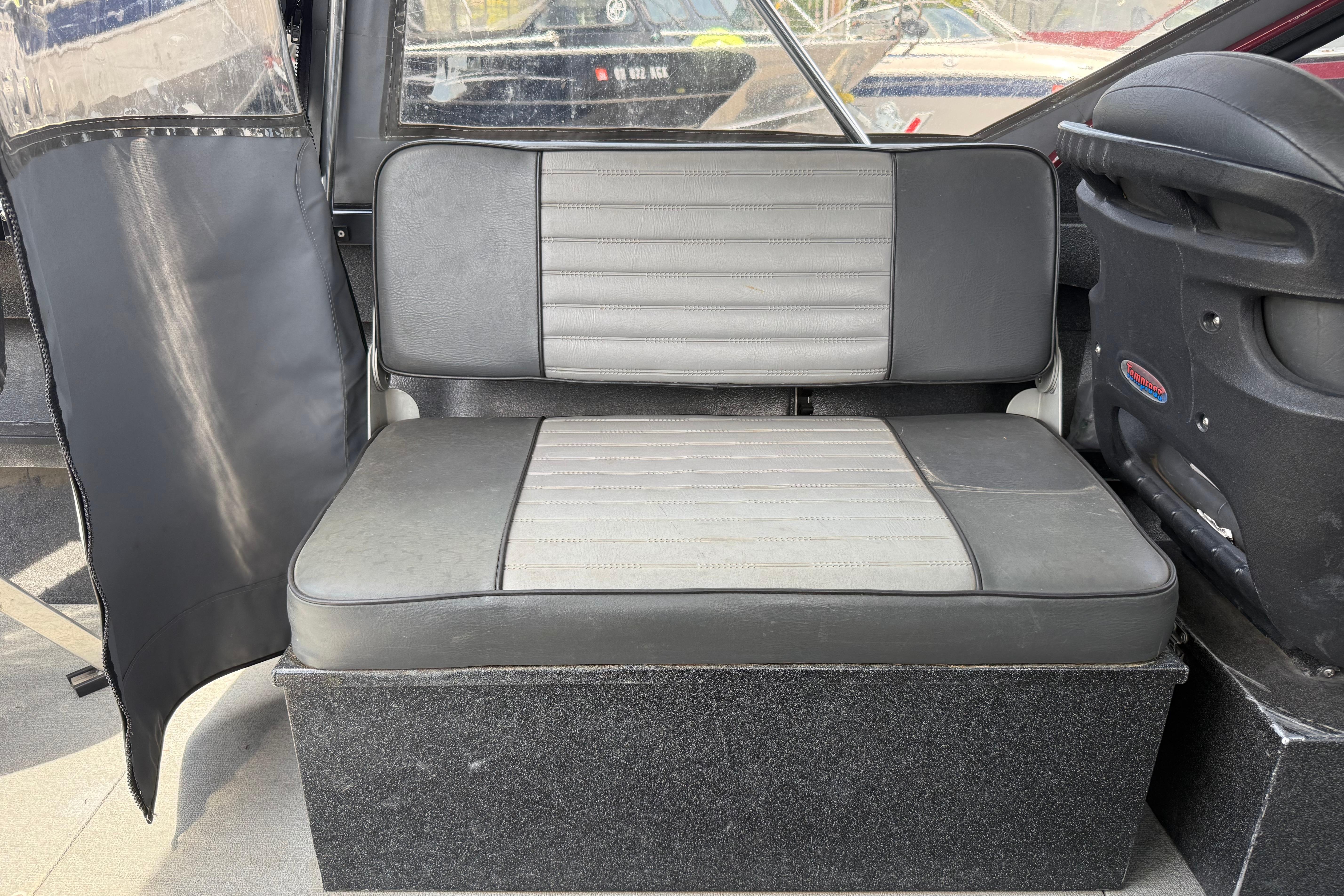 Interior seating of a 2005 Willie Raptor 21' boat, featuring gray upholstery.