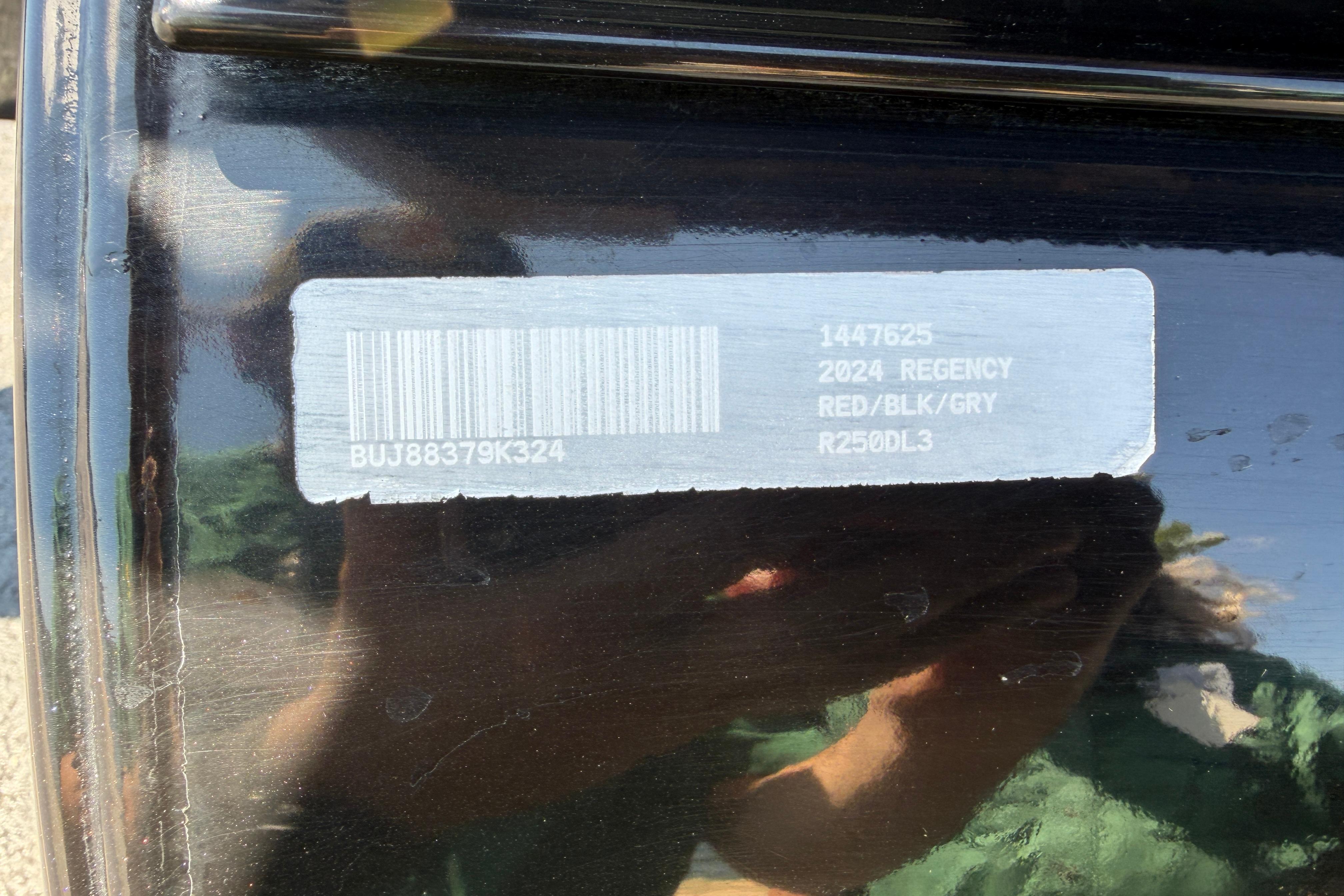 Barcode label on 2024 Regency R250DL3, red/black/grey color scheme.
