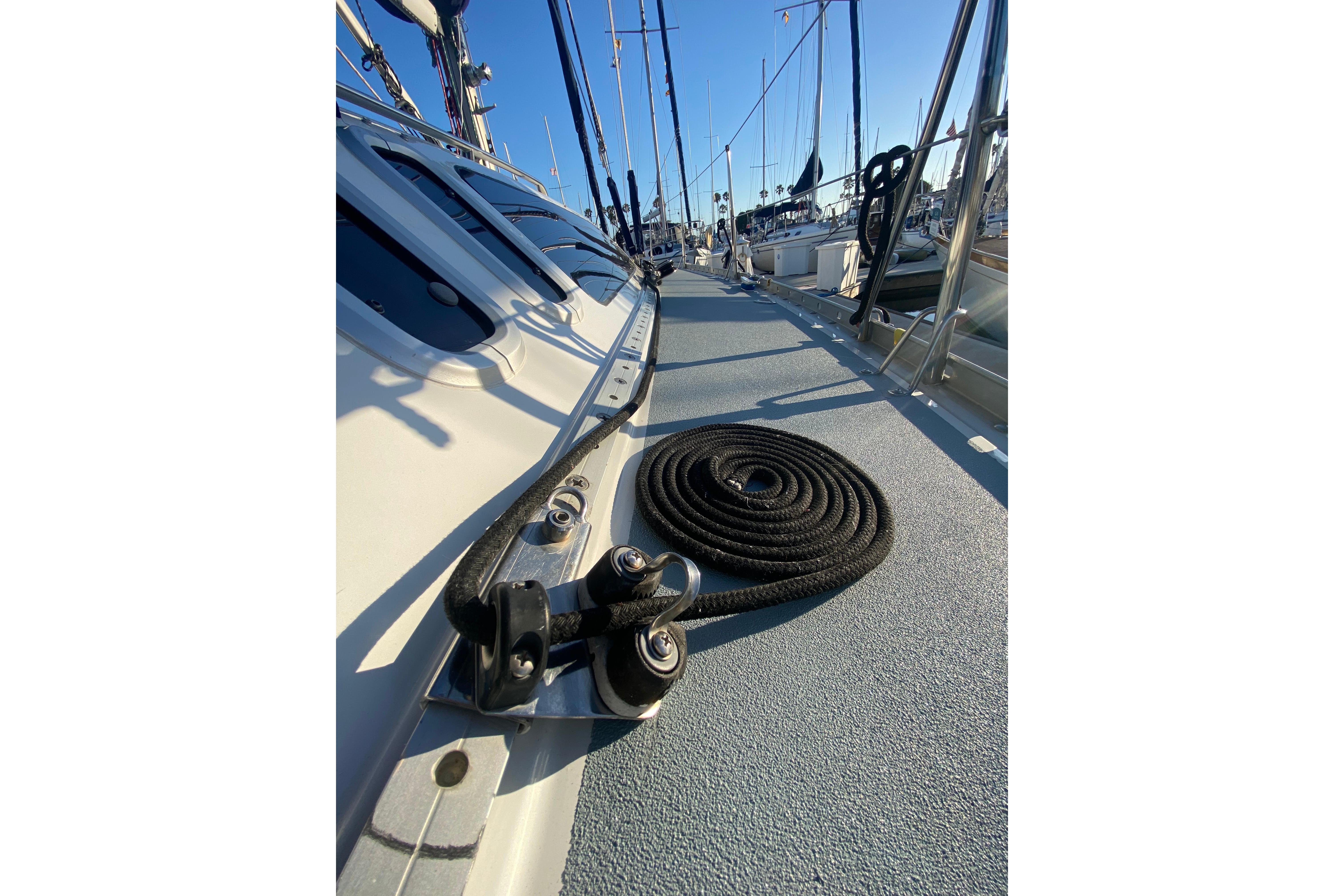 Deck view of a 1997 Hunter Legend 40.5 sailboat with coiled rope and rigging.