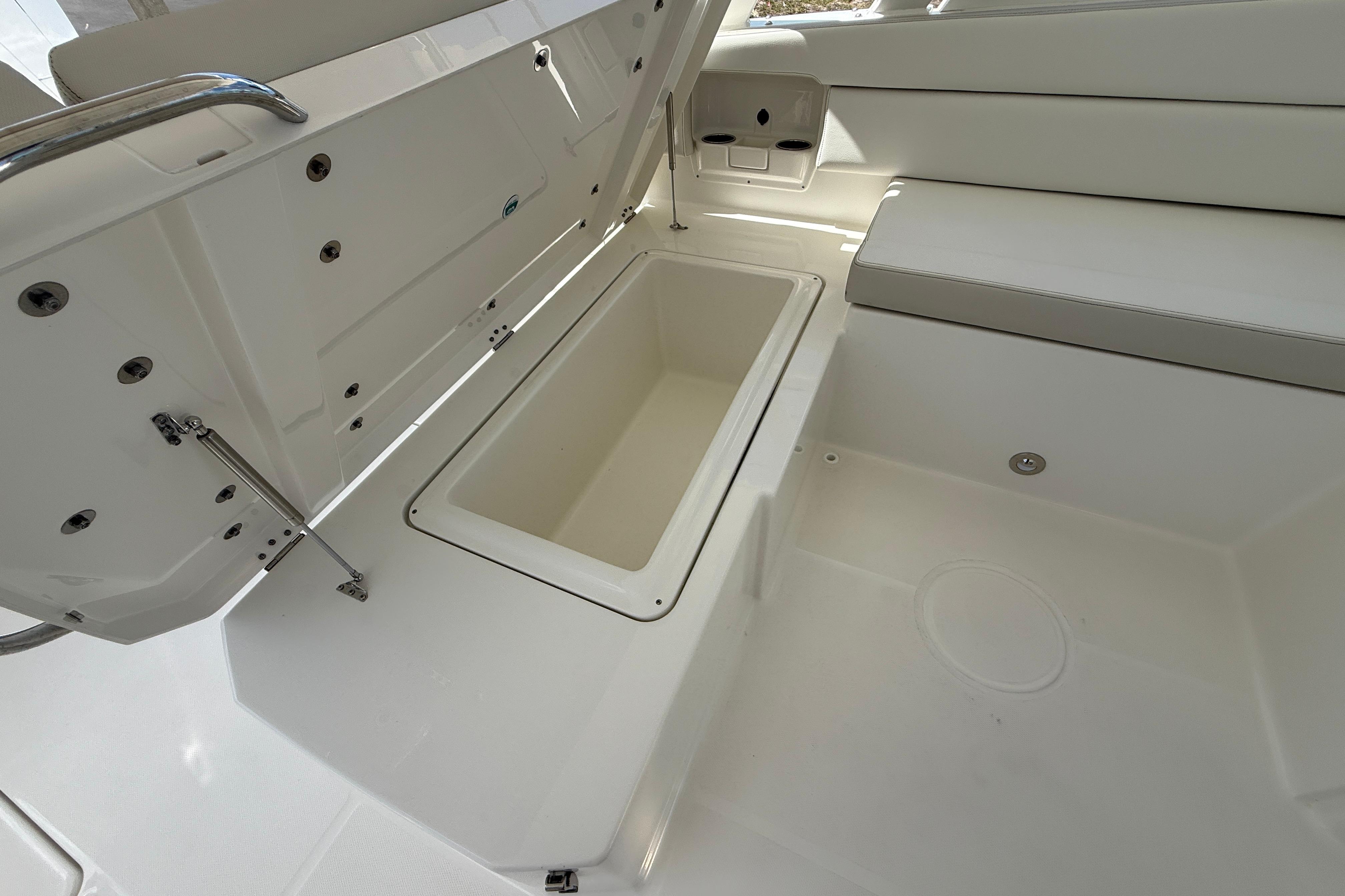 Open storage compartment on 2026 World Cat 400 DC-X Island boat interior.