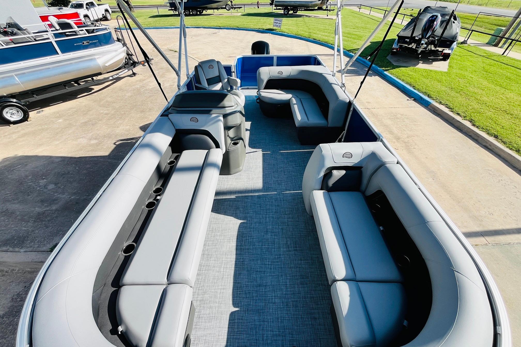 2026 Sun Tracker Party Barge 18 DLX pontoon boat with spacious seating and modern design.