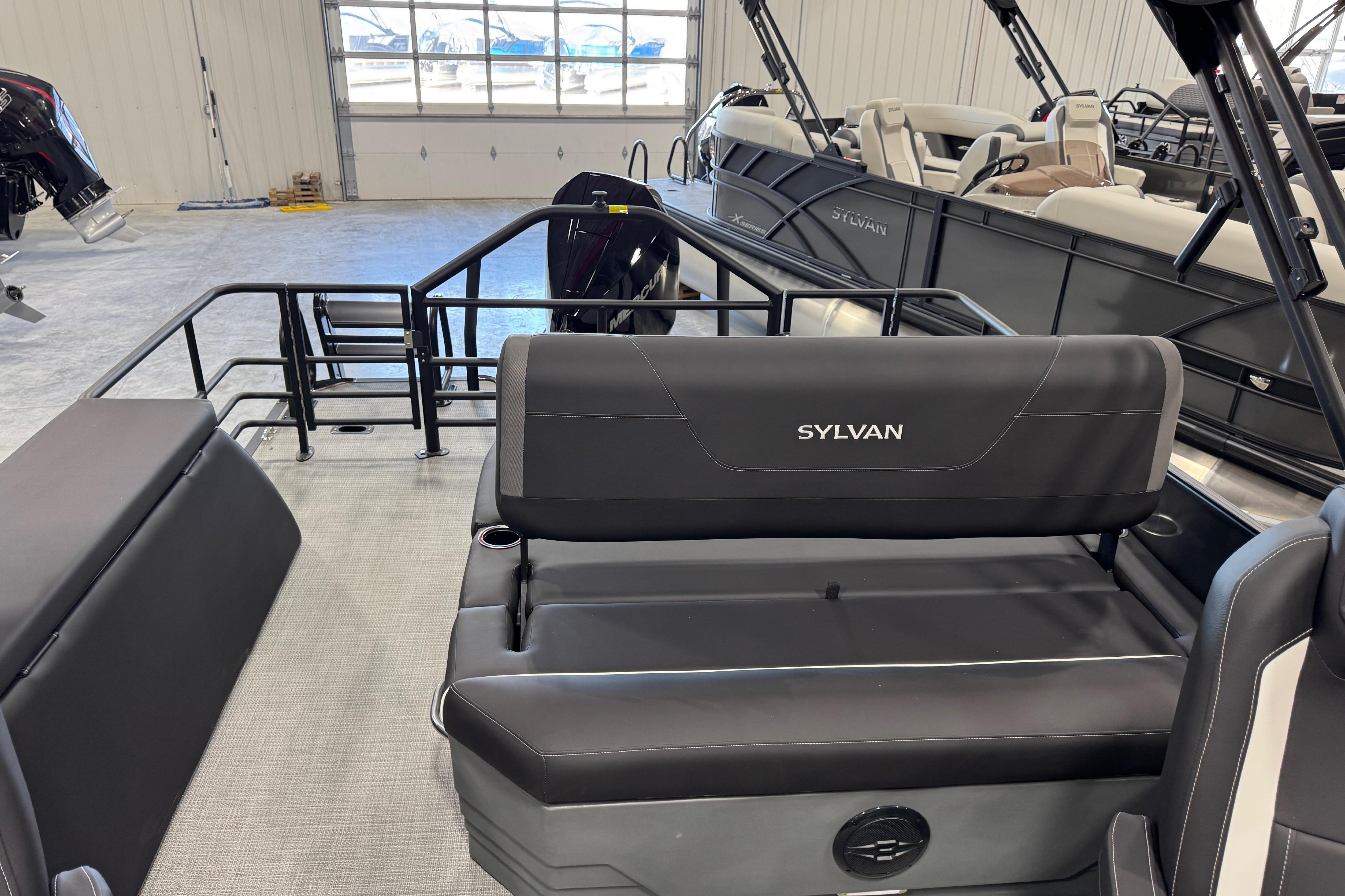 Interior view of 2026 Sylvan X5 boat with black seating and spacious layout.