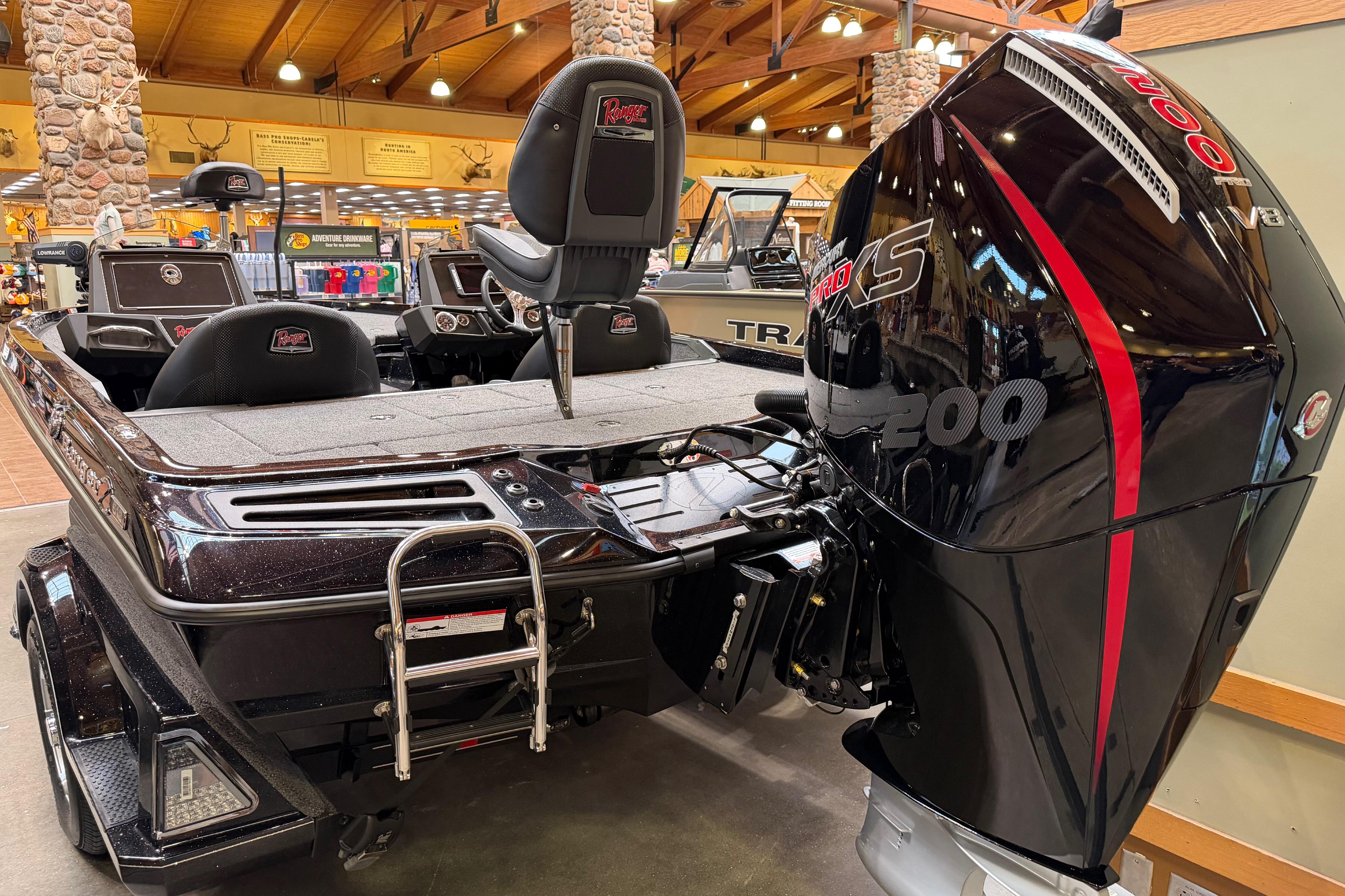 2026 Ranger Z518 boat with powerful engine displayed indoors.
