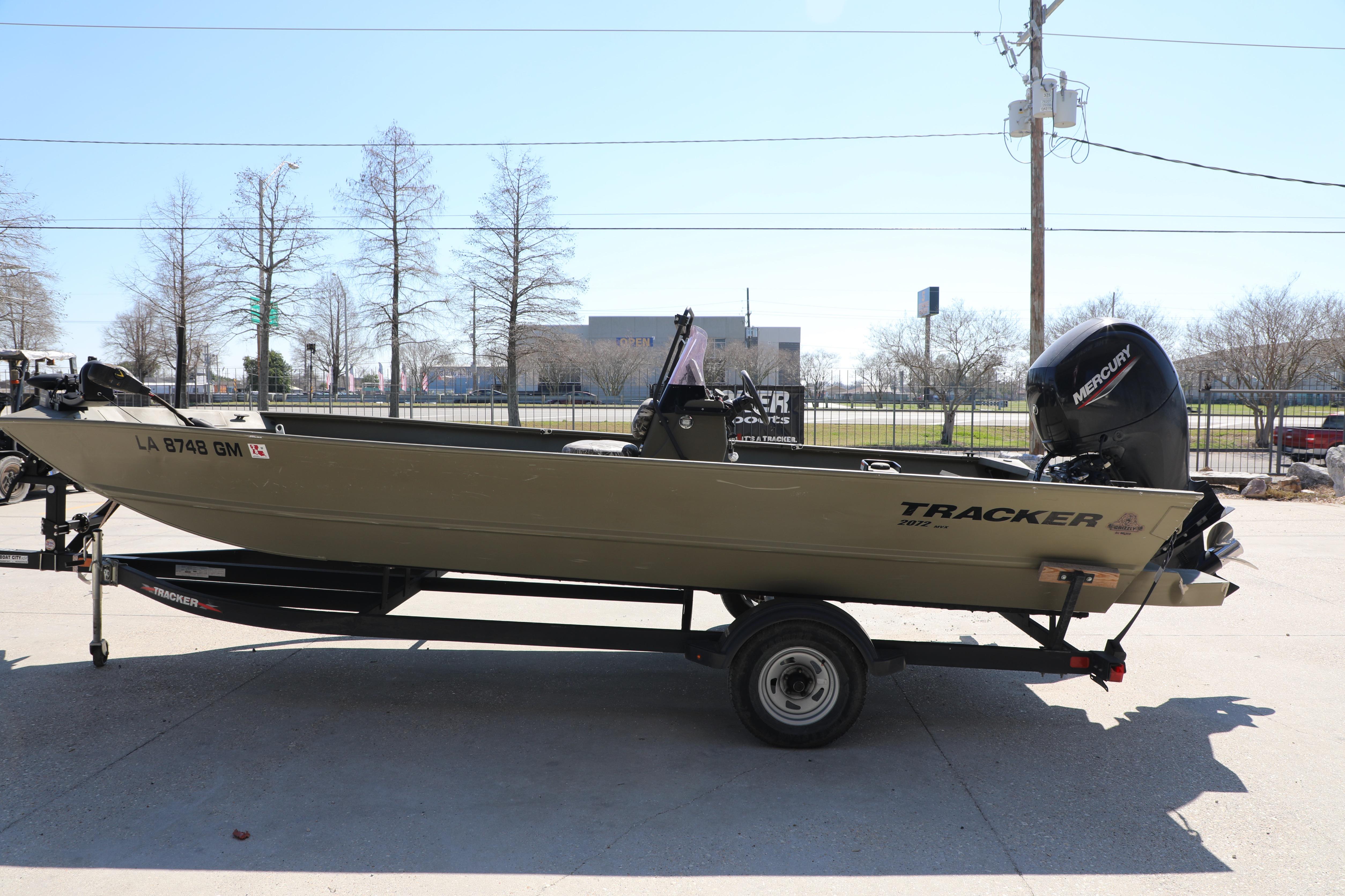 2021 Tracker Grizzly 2072 SC All-Welded boat on trailer, side view.