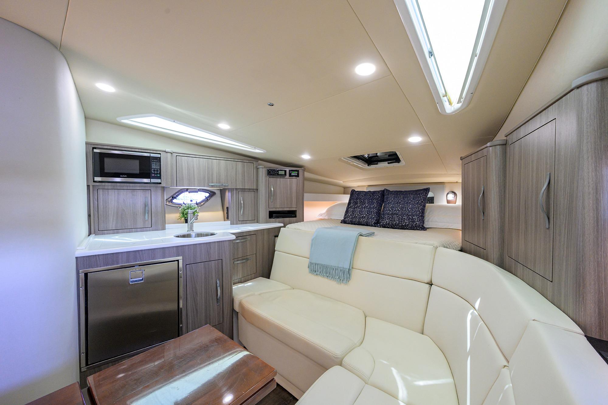 Luxurious interior of 2020 Regal 35 Sport Coupe with modern kitchen and cozy seating area.