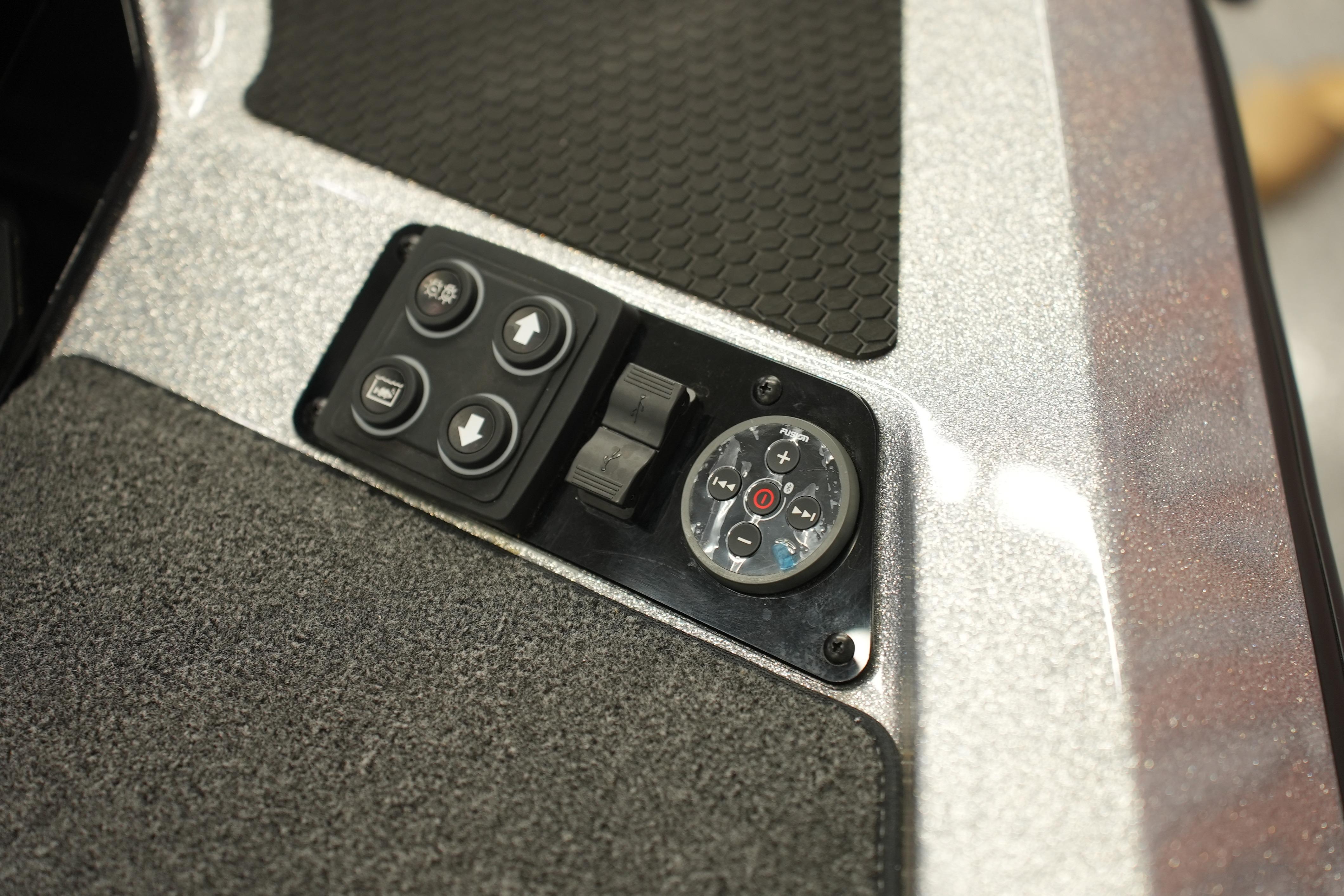 Control panel of 2026 iKon LXE20 with buttons and dials on textured surface.