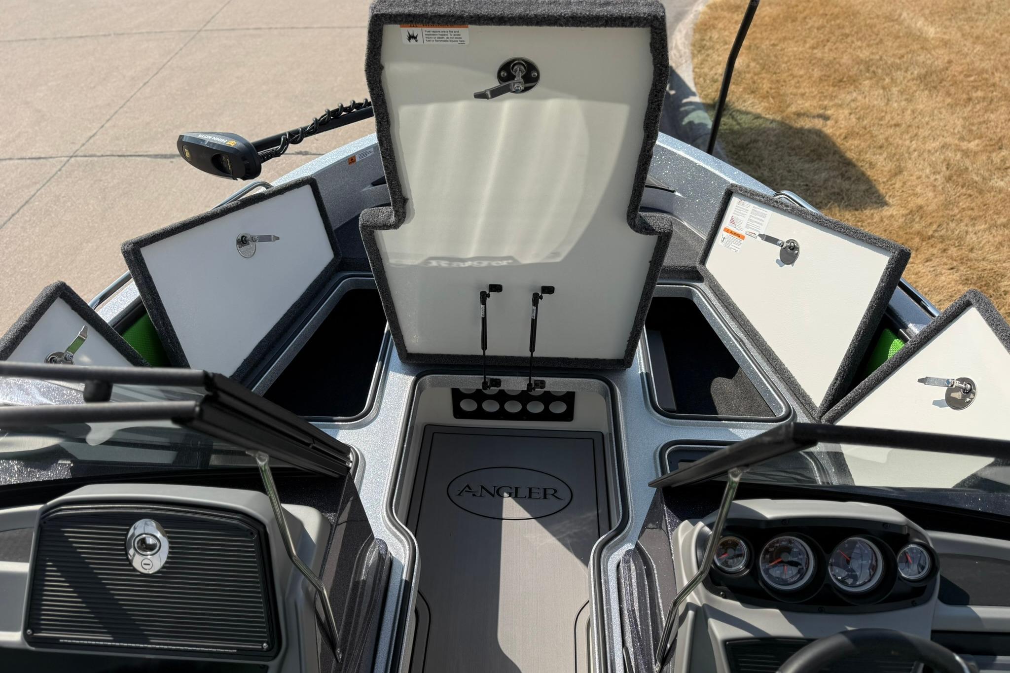 2026 Ranger 1880MS boat interior with open storage compartments and dashboard view.