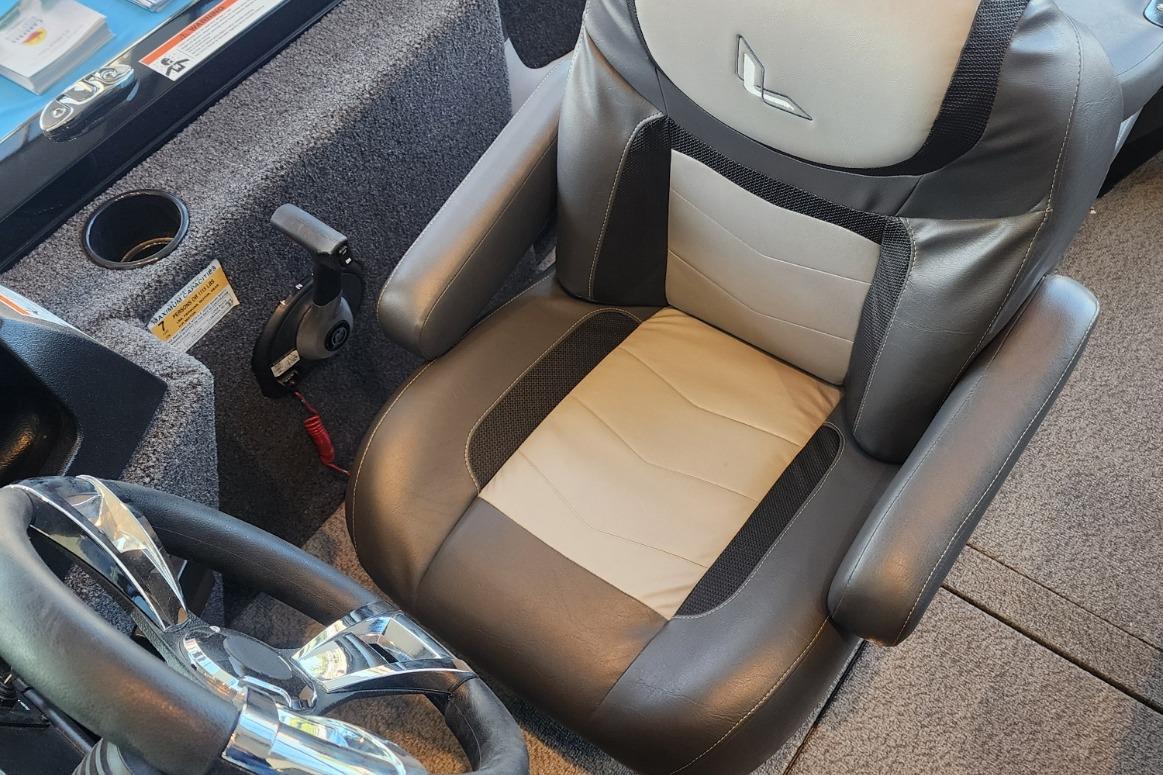 2023 Lowe boat captain's seat with steering wheel and control panel.
