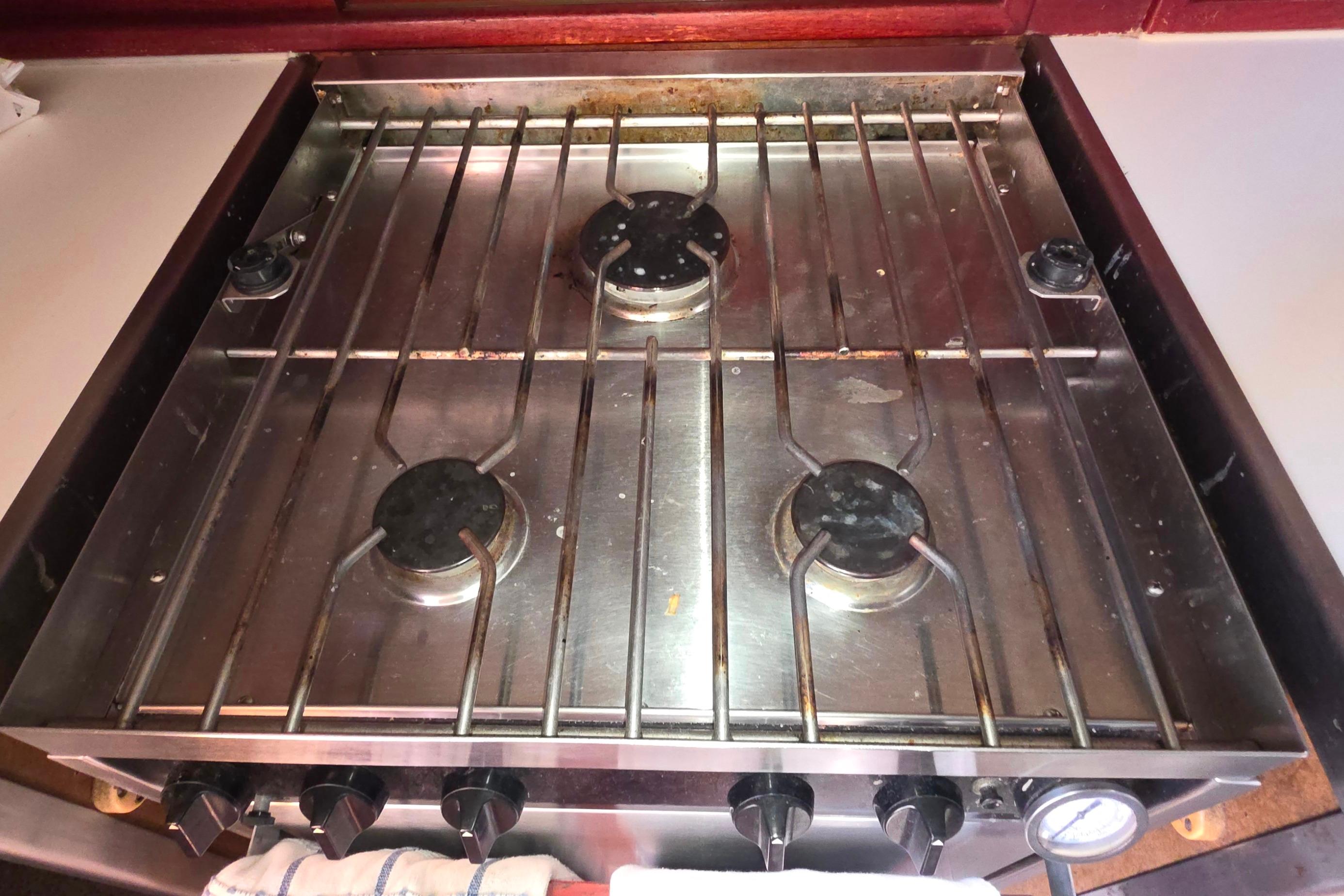Stainless steel stove with four burners on a 1978 Islander Freeport 41 yacht.