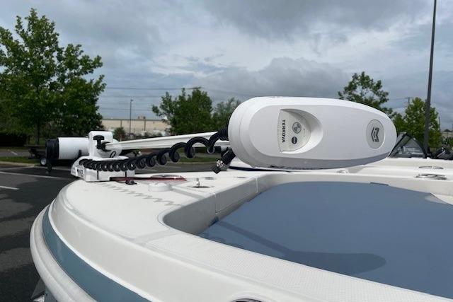 2025 Ranger 2360 Bay boat with advanced trolling motor in a parking lot.