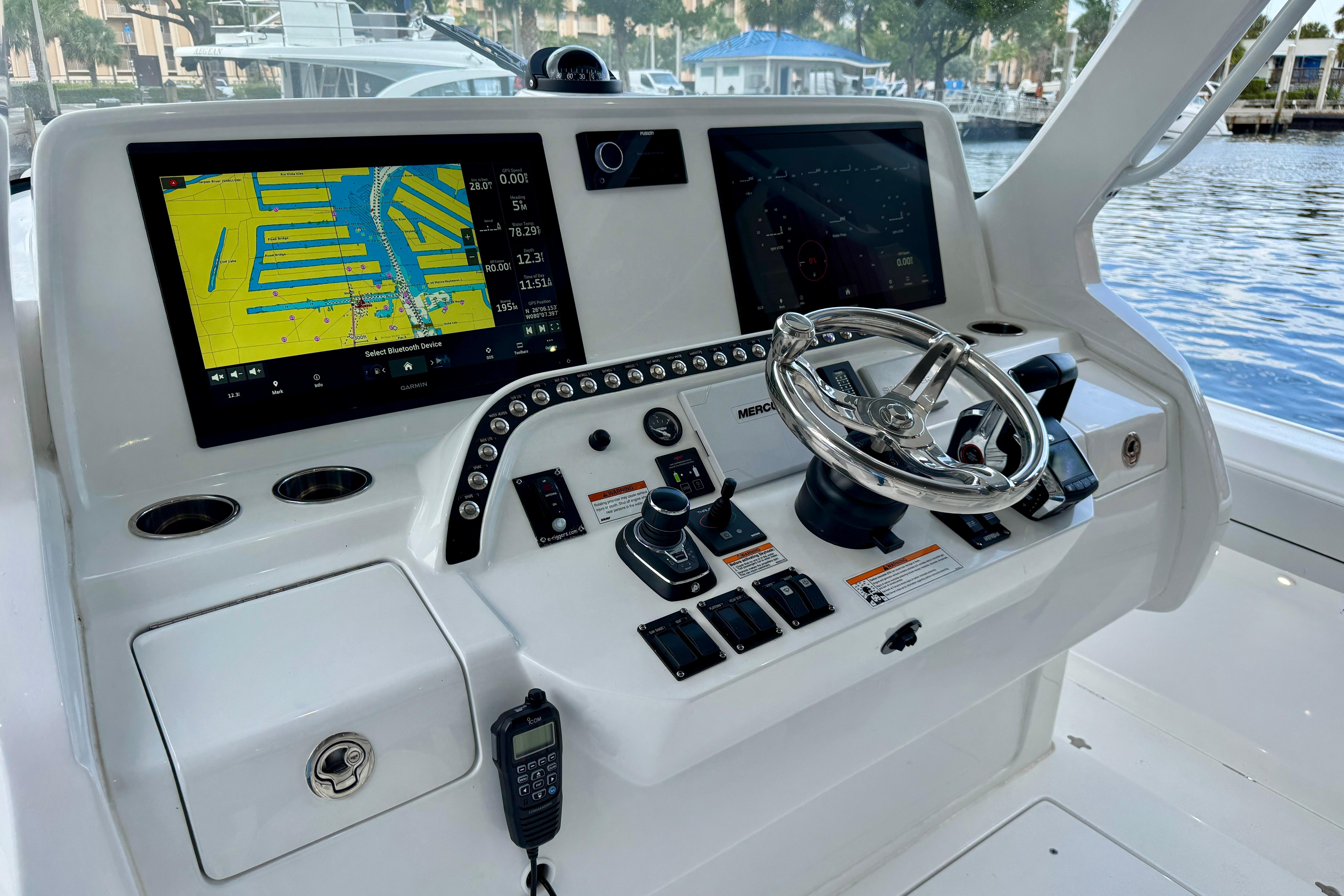 2024 Intrepid 427 Nomad SE helm with dual navigation screens and controls.