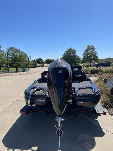 2024 Nitro Z19 boat with powerful outboard motor, parked outdoors.