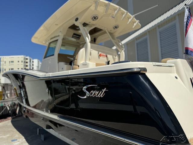 2022 Scout 330 LXF boat with sleek black and white design.