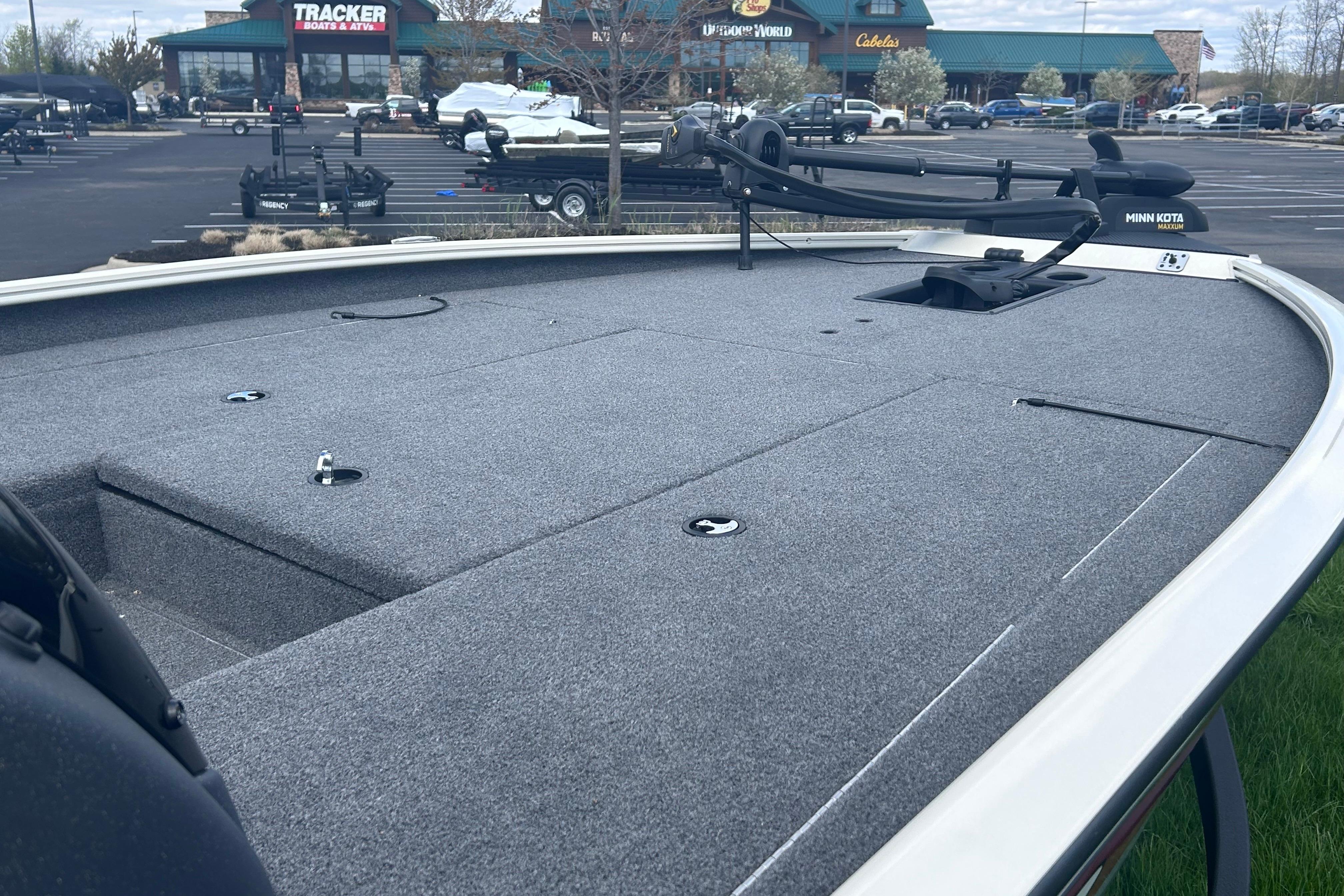 2025 Tracker Savage 215 boat deck with Minn Kota trolling motor at dealership.