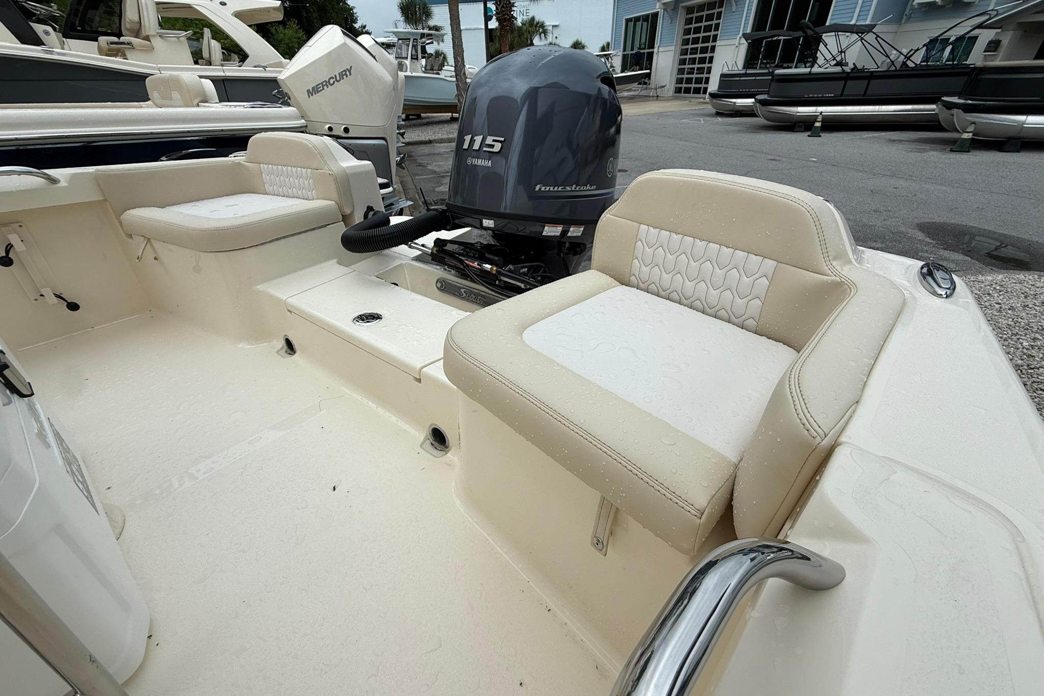 2027 Scout 188 Sportfish boat interior with Yamaha 115 engine, featuring cushioned seating.